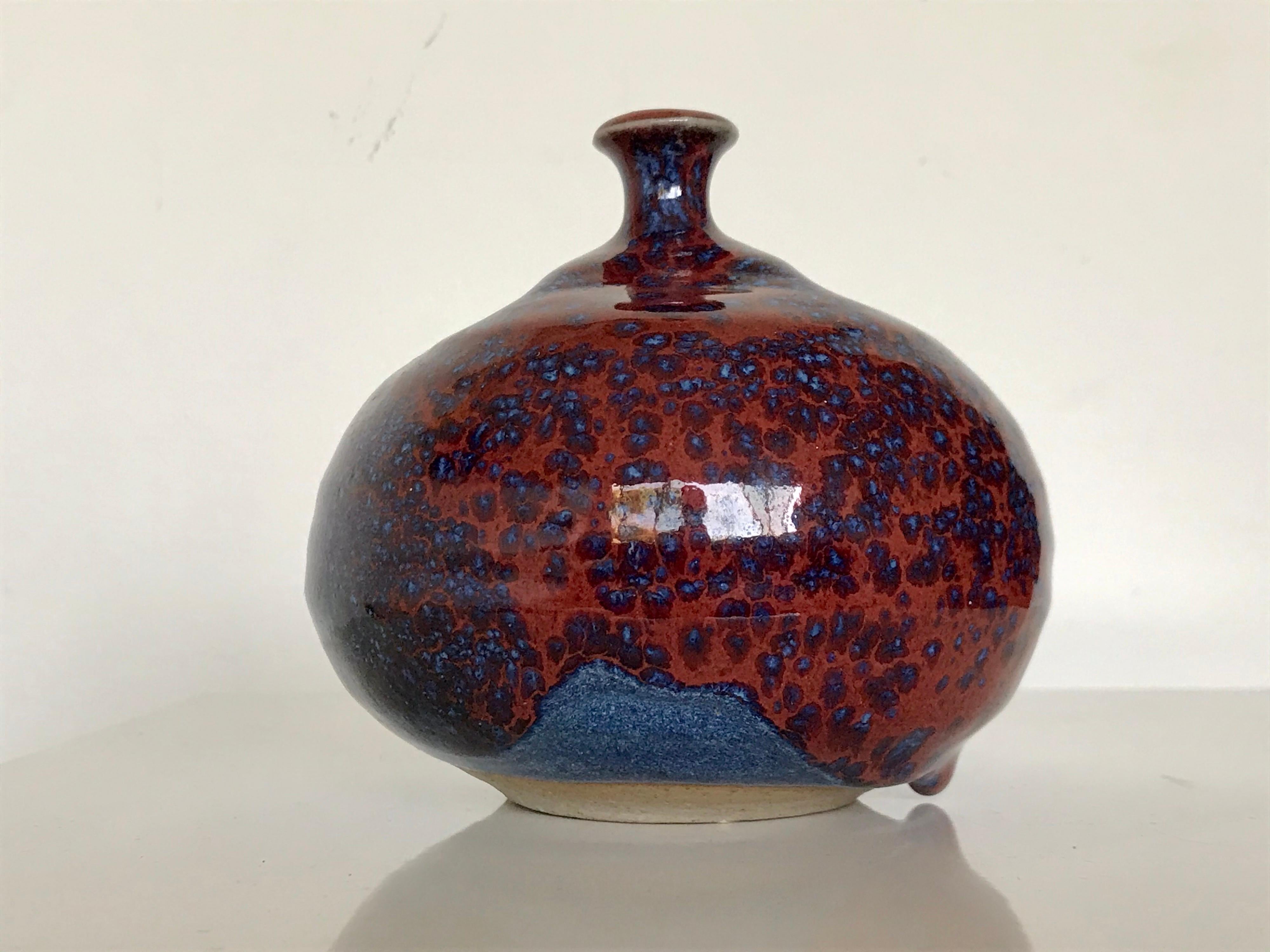 1925 - 2009
American artist, ceramics teacher, author and professor
a rare and wonderful piece of hers to come up for sale
wheel thrown clay with an amazing glaze hue of red and blues with one big glob drip accent
initialed on the bottom