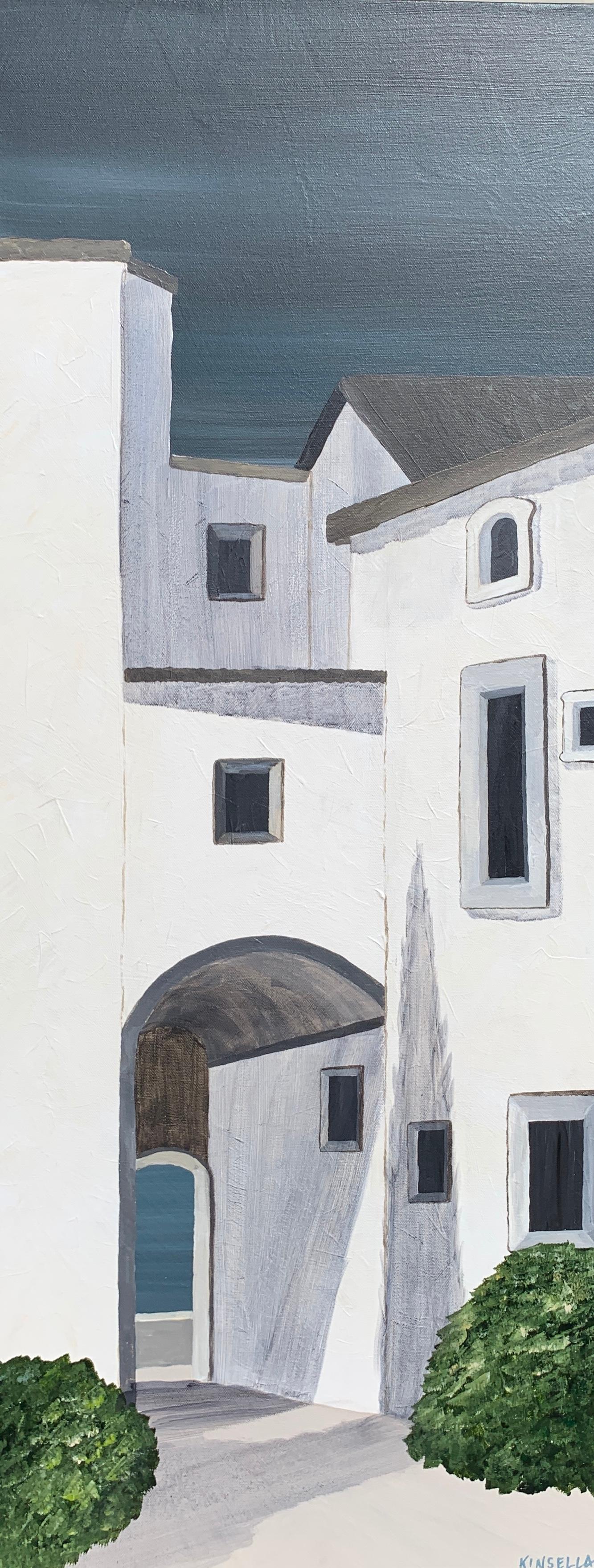 'L'Après Midi' is a slender contemporary acrylic on canvas painting created by American artist Susan Kinsella in 2019. Featuring a palette made of dark blue grey, off-white and green, the painting depicts a close view of a house, crossed by an
