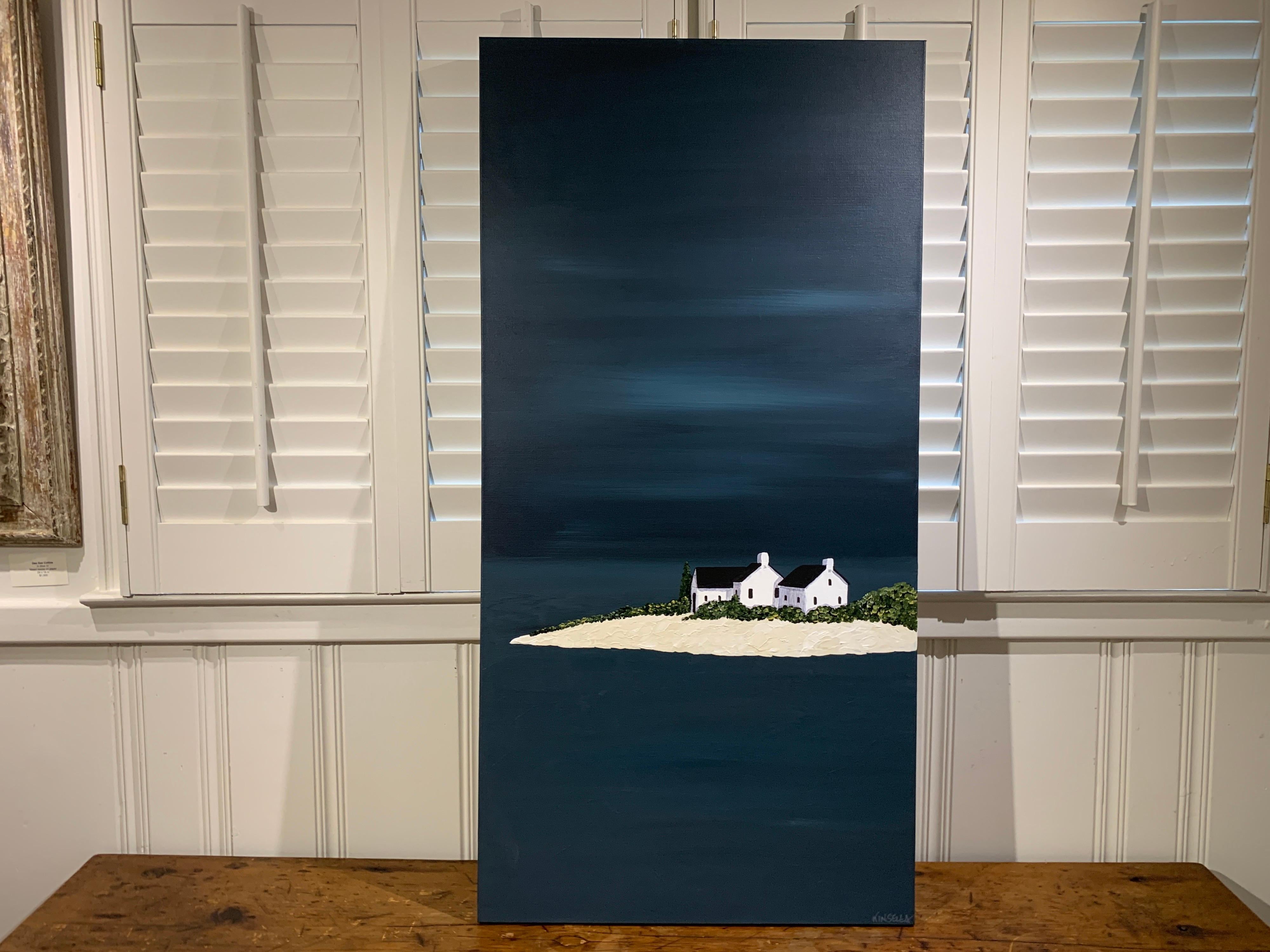 'Quietly Waiting' is a tall and narrow contemporary minimalist acrylic on canvas coastal painting of vertical format, created by American artist Susan Kinsella in 2020. Featuring a strong palette made of dark blue, black, beige, white and dark green