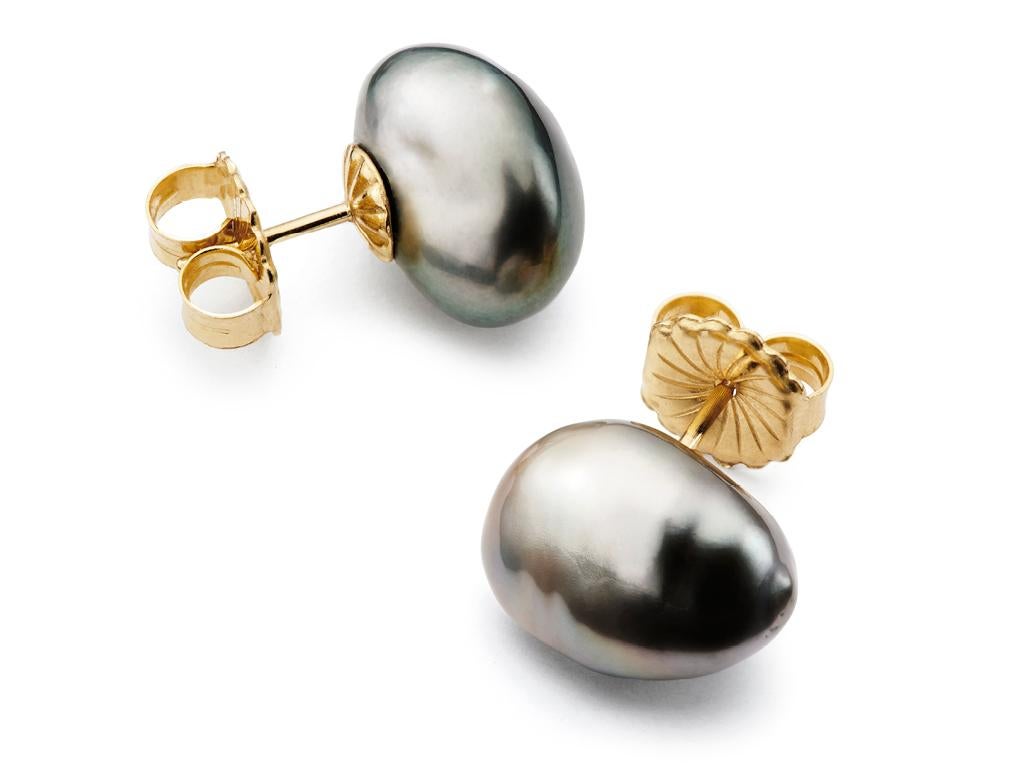 Perfect for any occasion, casual or formal. 11.5mm Black Tahitian Baroque Pearls with 18kt Yellow Gold backing. Available in pierced style.