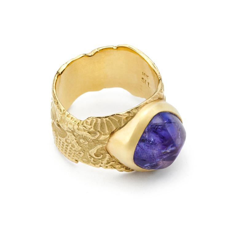A stunning Antique Cushion Cut Cabochon Tanzanite set in an 18kt Gold Georgette Band.