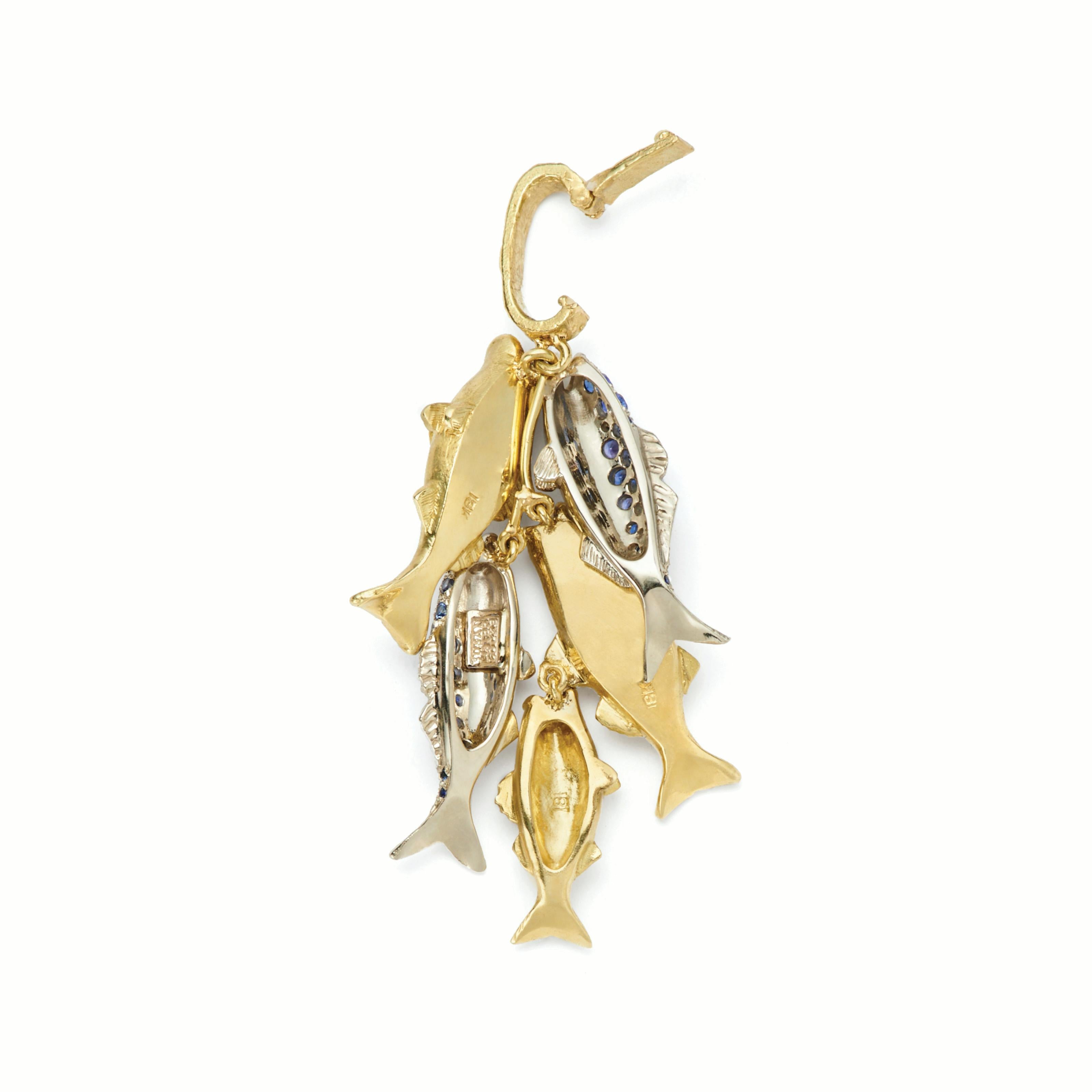 Don’t let any of these get away …

Our Daily Catch Pendant is made up of:
• 2 Large Nantucket Striped Bass Pendants in 18kt Yellow Gold
• 1 Small Nantucket Striped Bass Pendant in 18kt Yellow Gold
• 2 Nantucket Bluefish Sapphire and 18kt White Gold