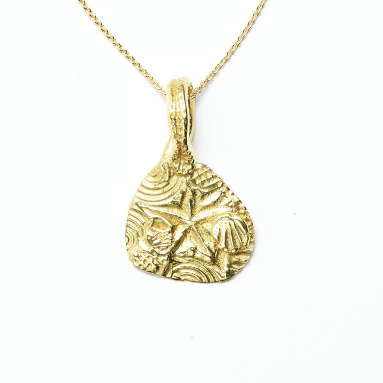 One of our most popular designs, this 18kt Gold pendant features an original seascape-inspired design.

Also available in Sterling Silver.

Chain sold separately.
