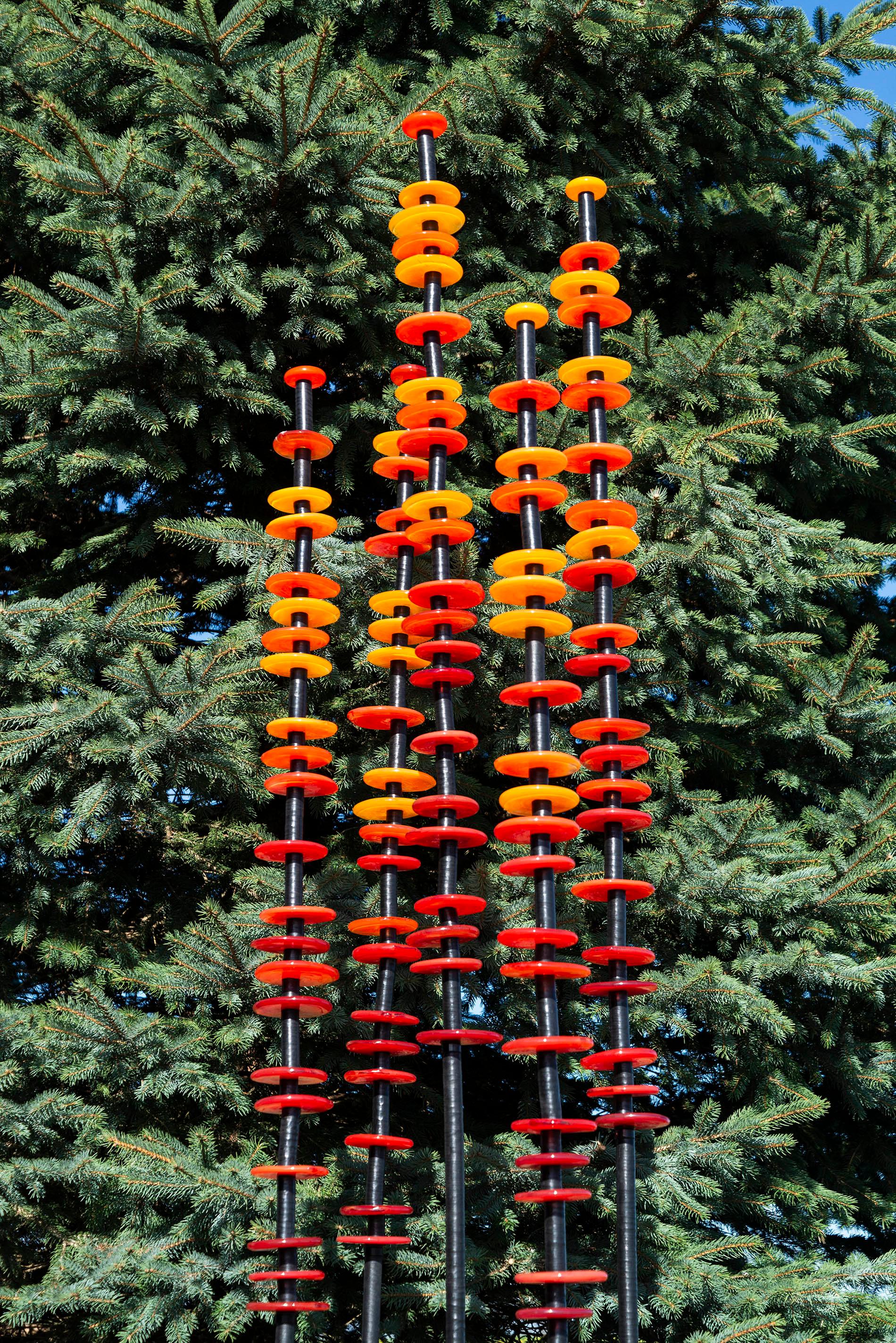 The colours of a hot summer sun—a juicy orange and a golden yellow are captured in glass in this compelling outdoor sculpture by Susan Rankin. The Canadian artist’s garden columns were inspired by her love of gardening and deep respect for nature’s