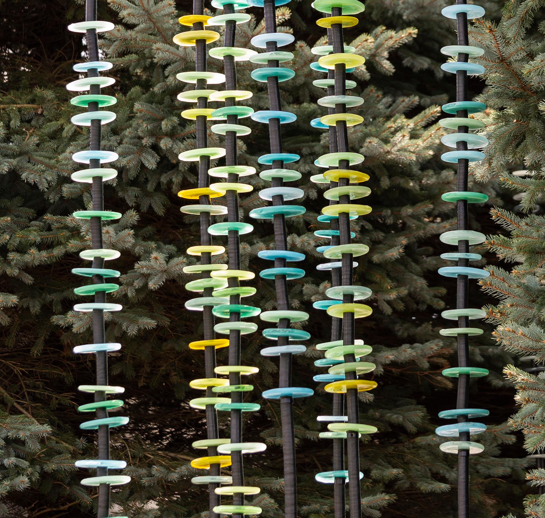 This contemporary, hand-blown glass and steel outdoor sculpture is by Susan Rankin. Susan Rankin’s elegant and colorful hand-blown glass art has been exhibited across North America in many prestigious venues. Her series of uniquely beautiful ‘Garden
