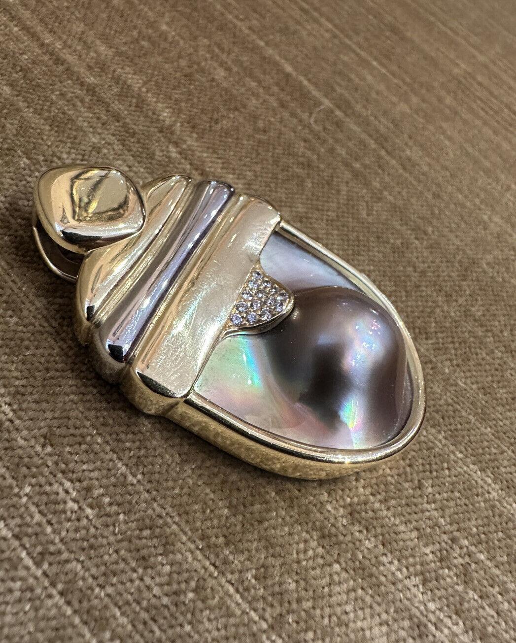 SUSAN SADLER Large Pearl and Diamond Pendant in 18k White Gold and Yellow Gold 

Mabe Pearl Pendant features a Large Mabe Pearl with Grey, Mauve, Pink, and Purple tones and very good luster set with Round Brilliant Diamonds in 18k Yellow and White