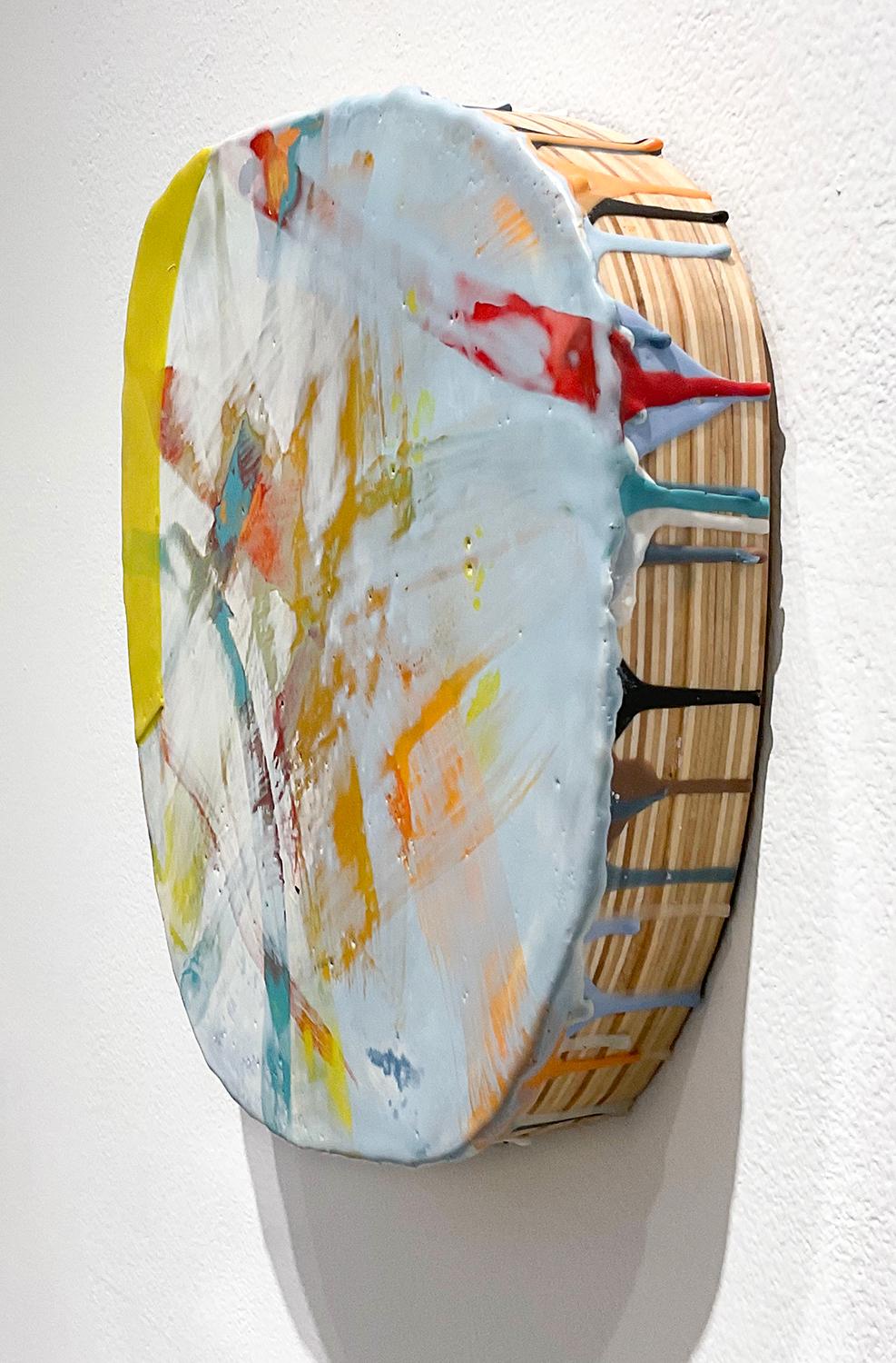 Abstract expressionist style three dimensional wall sculpture with gestural applications of pastel blue, yellow, green, teal, orange, and white encaustic on a hand-carved round wood panel
