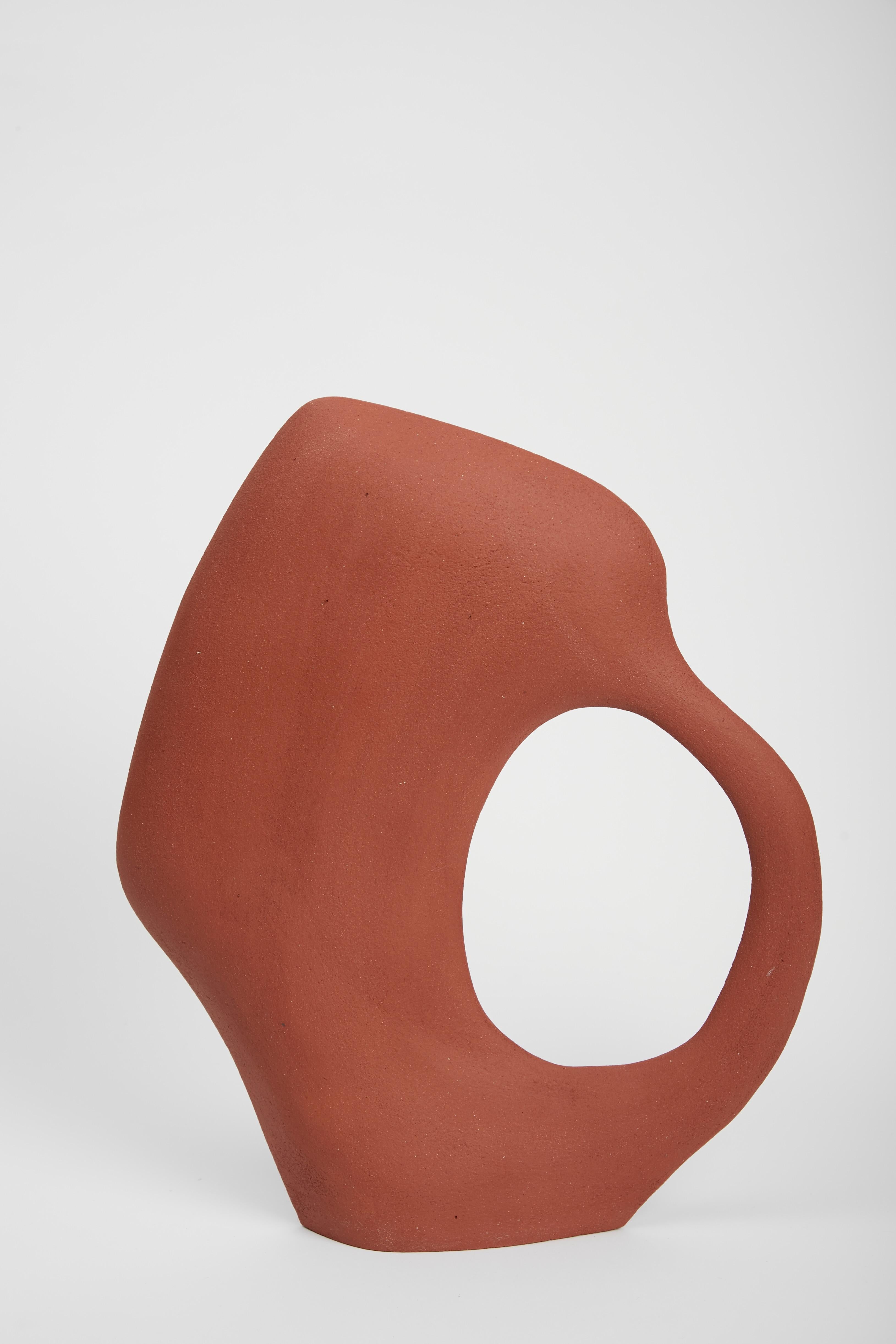 Susan Tribu 33.22 sculpture by Léontine Furcy
Unique piece.
Materials: Raw red sandstone.
Dimensions: L 30 x H 35 cm.

Léontine Furcy, ceramic artist, tells about herself in shapes, textures, curves, asymmetries, purifications. Each of the