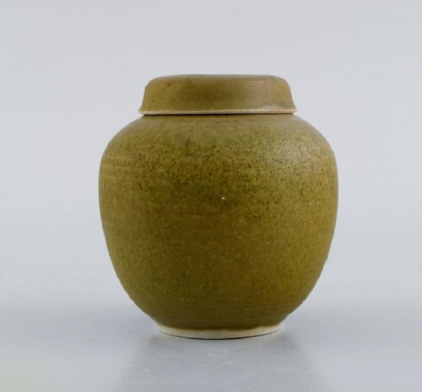 Susanne & Christer, Sweden. Lidded jar in glazed ceramics. Beautiful glaze in light earth tones. Late 20th century.
Measures: 9 x 8.7 cm.
In excellent condition.
Signed.