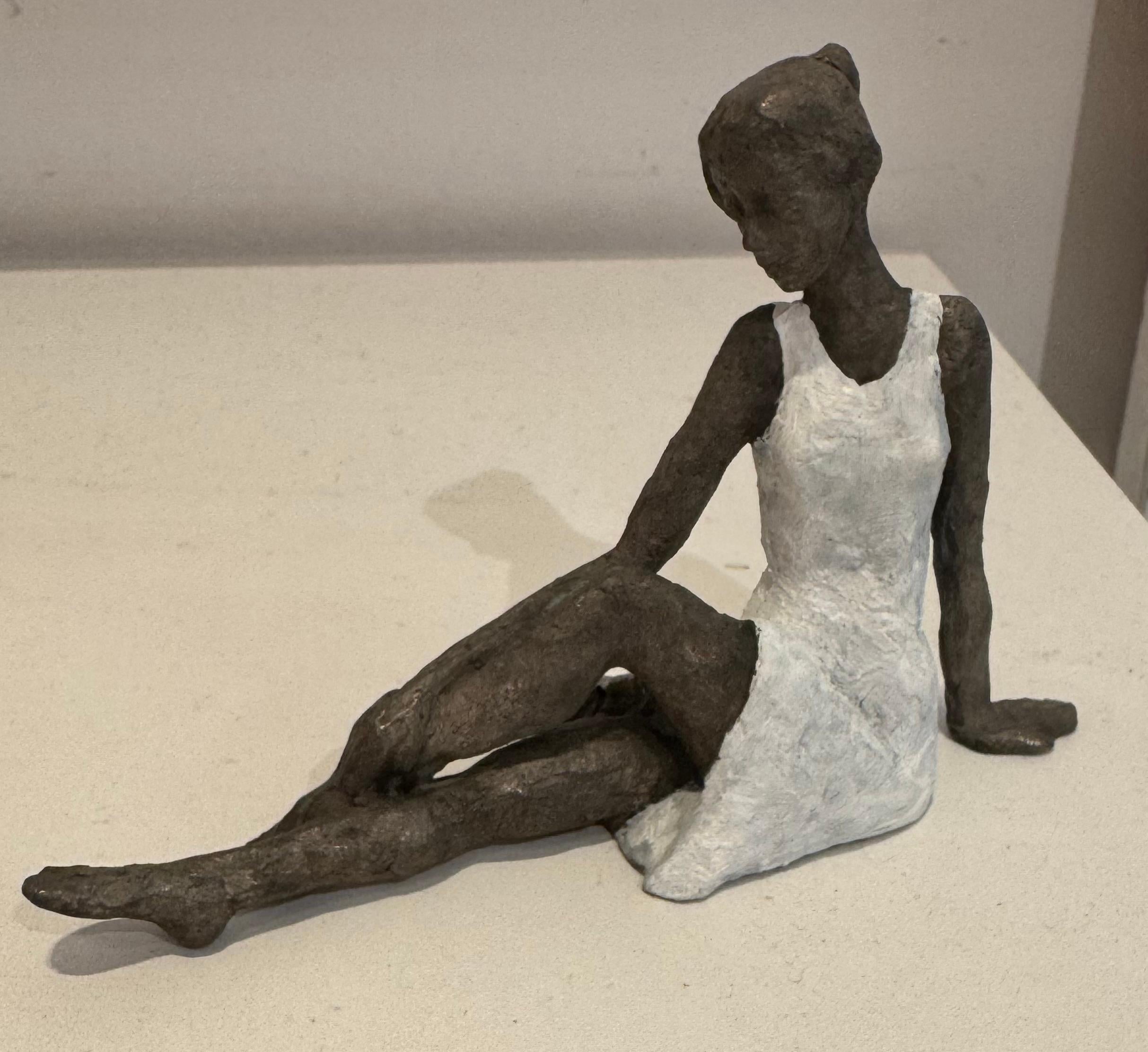 Elongated Sitting Girl I- contemporary bronze sculpture, female with white dress - Sculpture by Susanne Kraisser