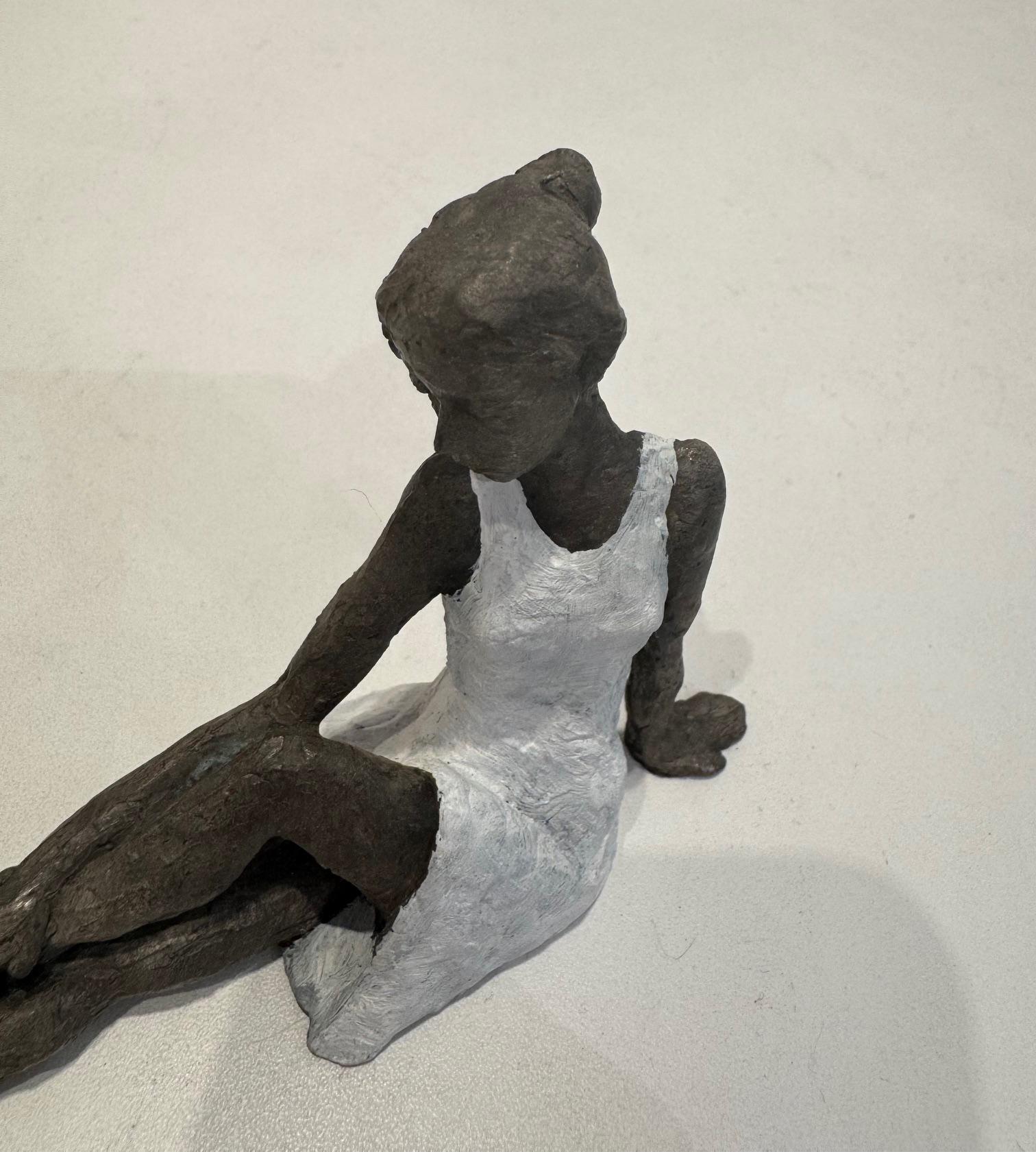 Elongated Sitting Girl I- contemporary bronze sculpture, female with white dress For Sale 1