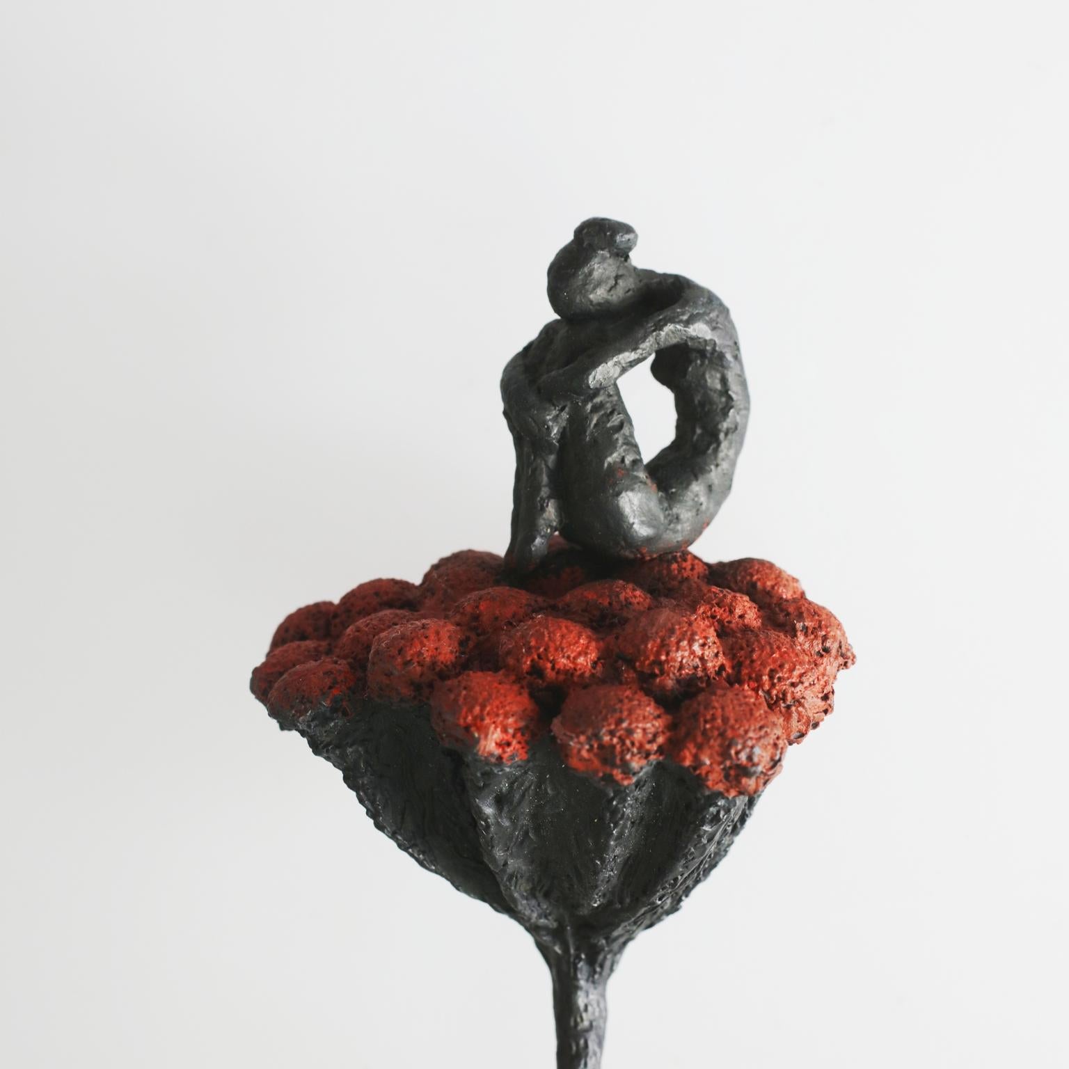 Flora - contemporary bronze wall sculpture of sitting female on red flower stem - Sculpture by Susanne Kraisser
