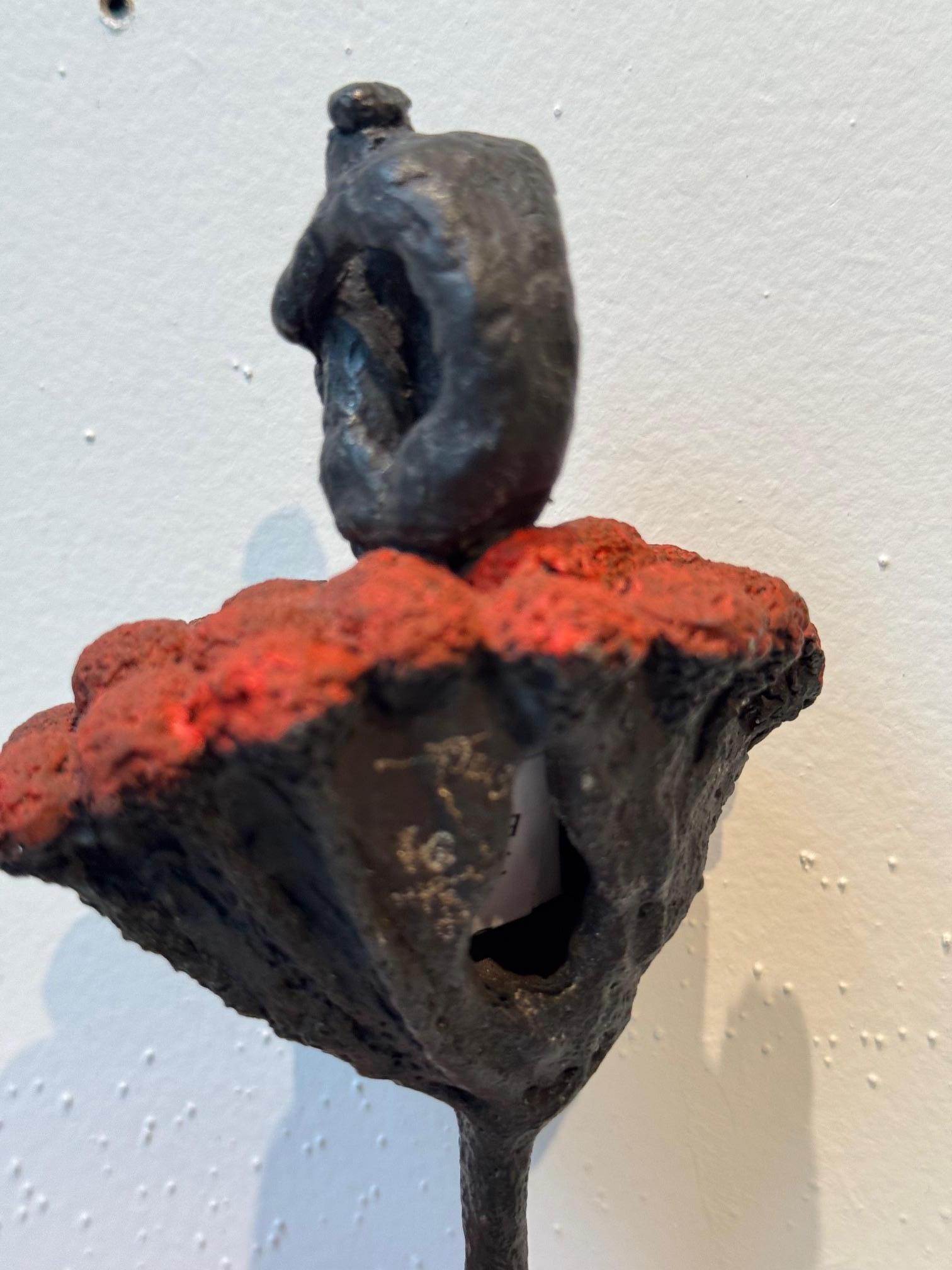 Flora - contemporary bronze wall sculpture of sitting female on red flower stem - Contemporary Sculpture by Susanne Kraisser