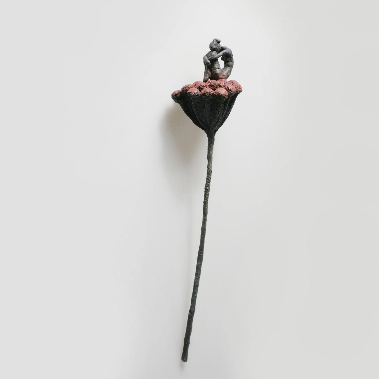 Susanne Kraisser Figurative Sculpture - Flora - contemporary bronze wall sculpture of sitting female on red flower stem