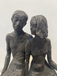 Pair  - contemporary bronze sculpture of a seated couple on a wooden block