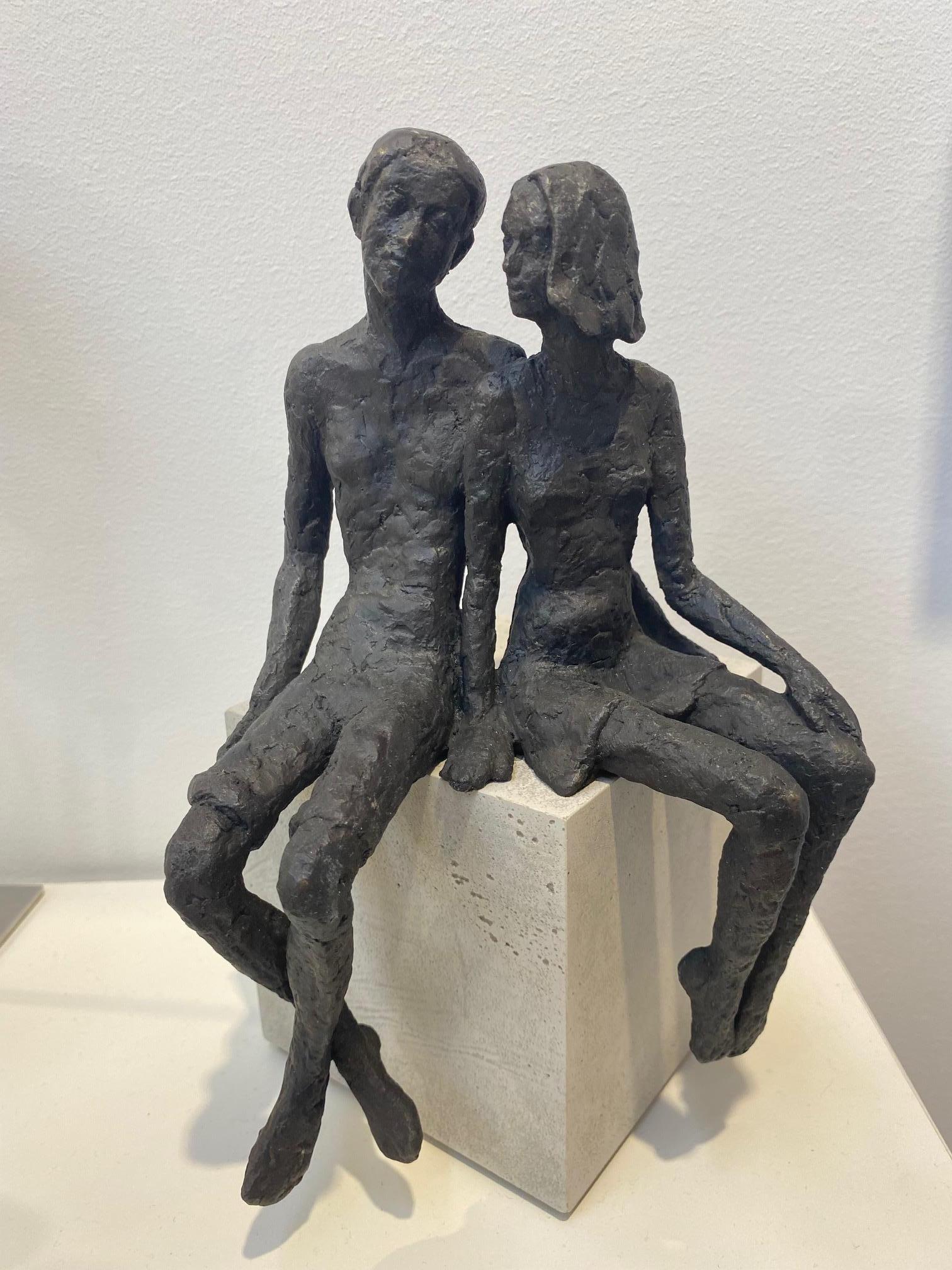 Pair  - contemporary bronze sculpture of a seated couple on a wooden block - Contemporary Sculpture by Susanne Kraisser