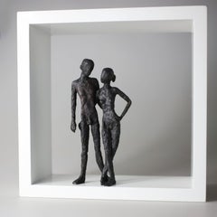 Two- contemporary minimalist bronze sculpture nude couple standing in wood-frame