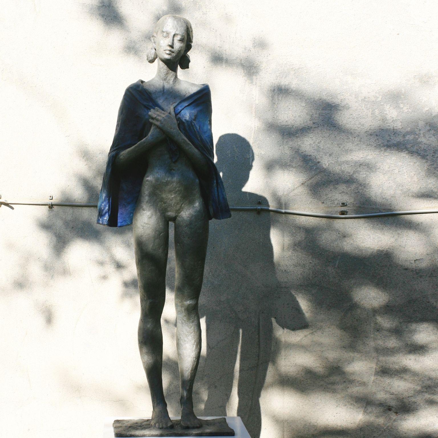 Woman with Blue Cape (Day after Christmas) - contemporary bronze sculpture  - Gold Figurative Sculpture by Susanne Kraisser