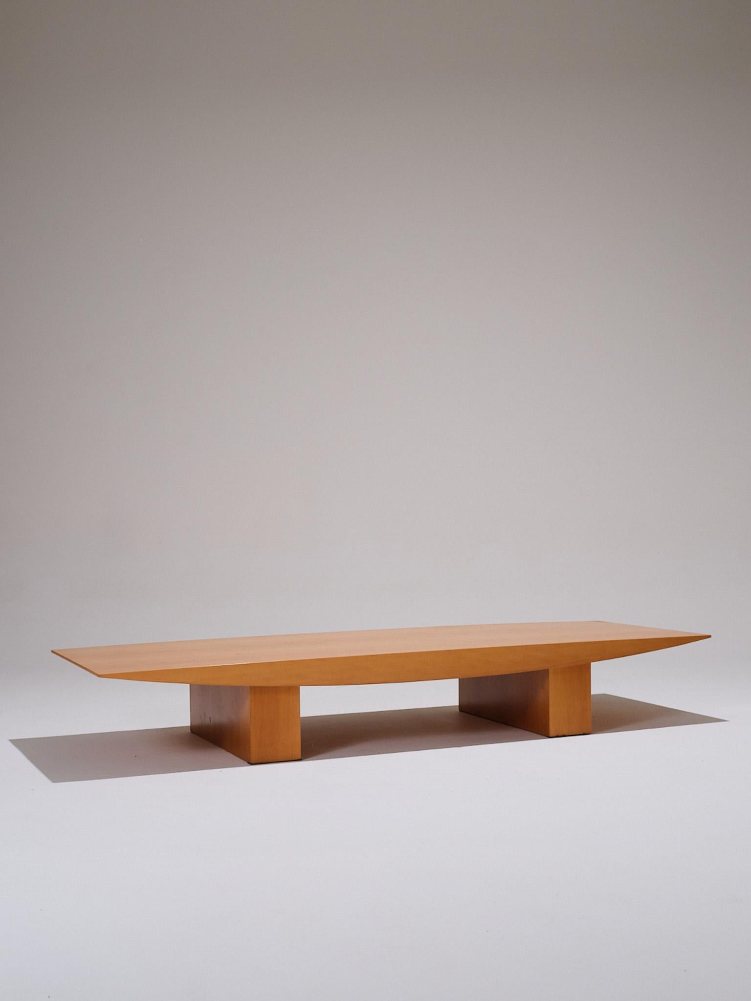 “Sushi” Coffee Table, designed by Gilles Derain and produced by Lumen Center Milano in the 1990s.
This iconic design features a wooden structure with clean lines, supported by two lateral legs holding a wide, streamlined rectangular top. In overall
