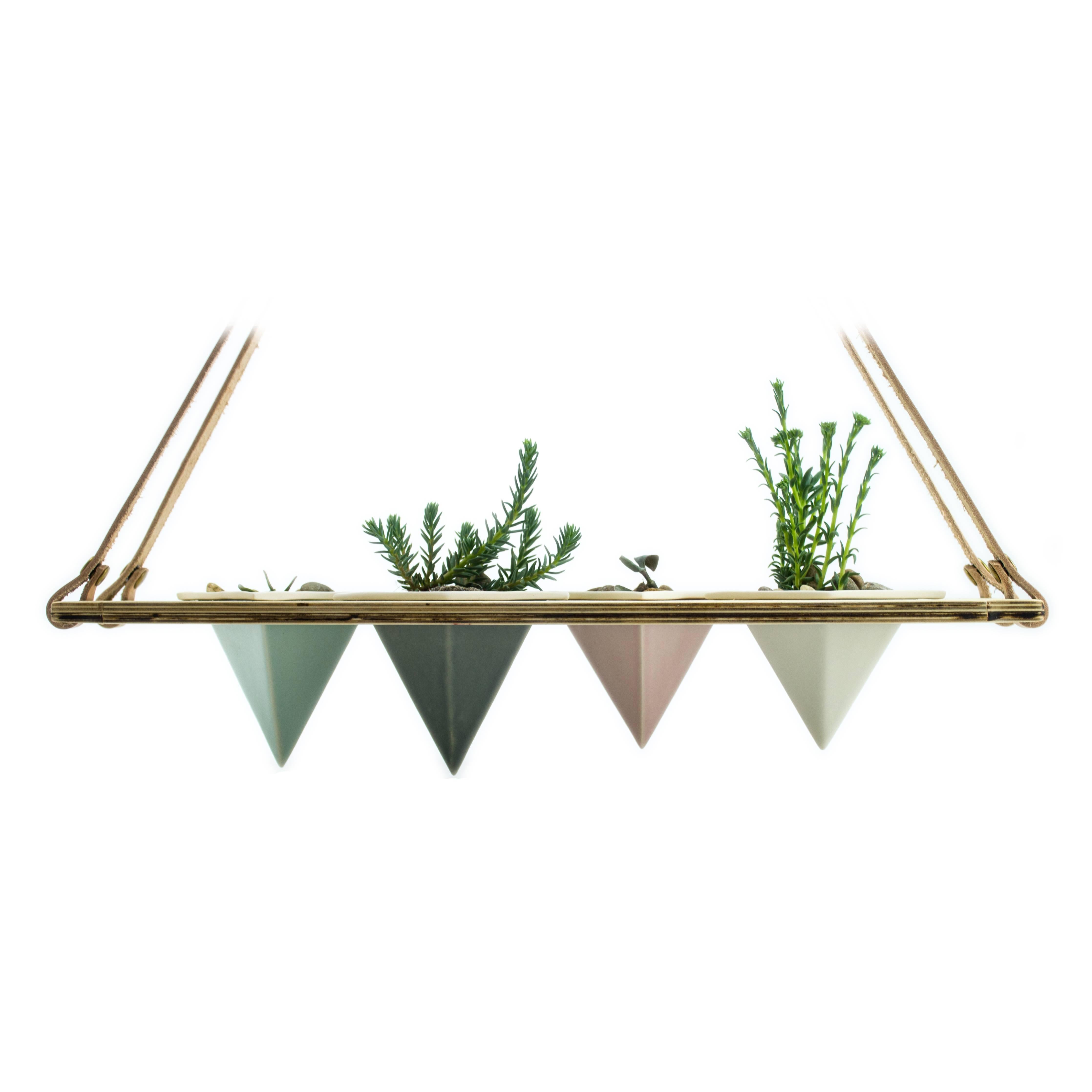 Suspended planter
-A cohesive, beautiful set up for any home - plant your favourite succulents and enjoy the view. Lightweight combination of porcelain in assorted colors, wood, and leather from In Blue Handmade - a collaboration with In Blue