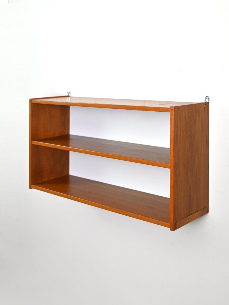 Suspended teak wood bookcase For Sale at 1stDibs
