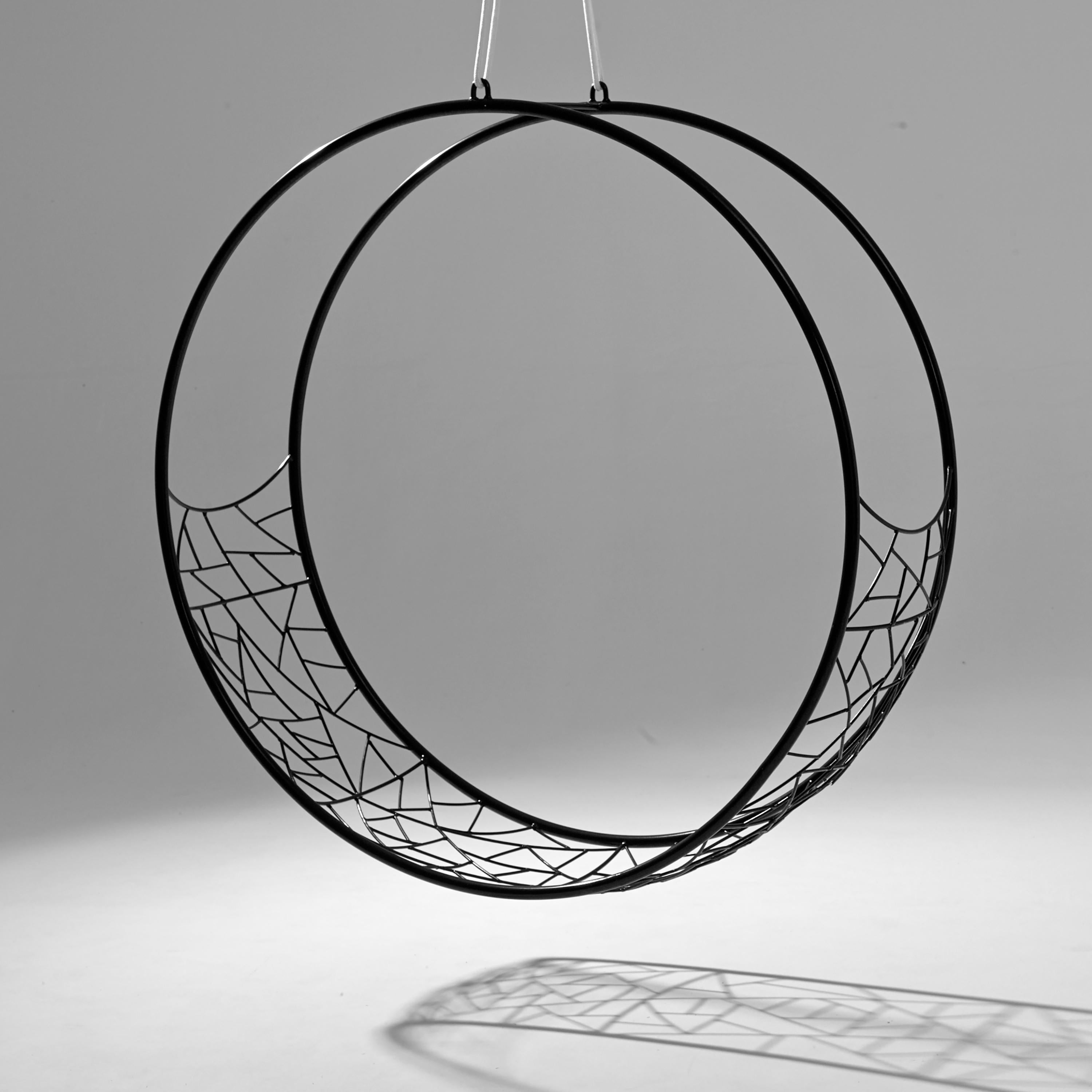 The WHEEL swing seat is sculptural and dynamic. Its striking circular shape lends itself for use as a functional art piece.
The chair has an open yet enveloping feel. 
The pattern detail is inspired by nature and reminiscent of the veins in