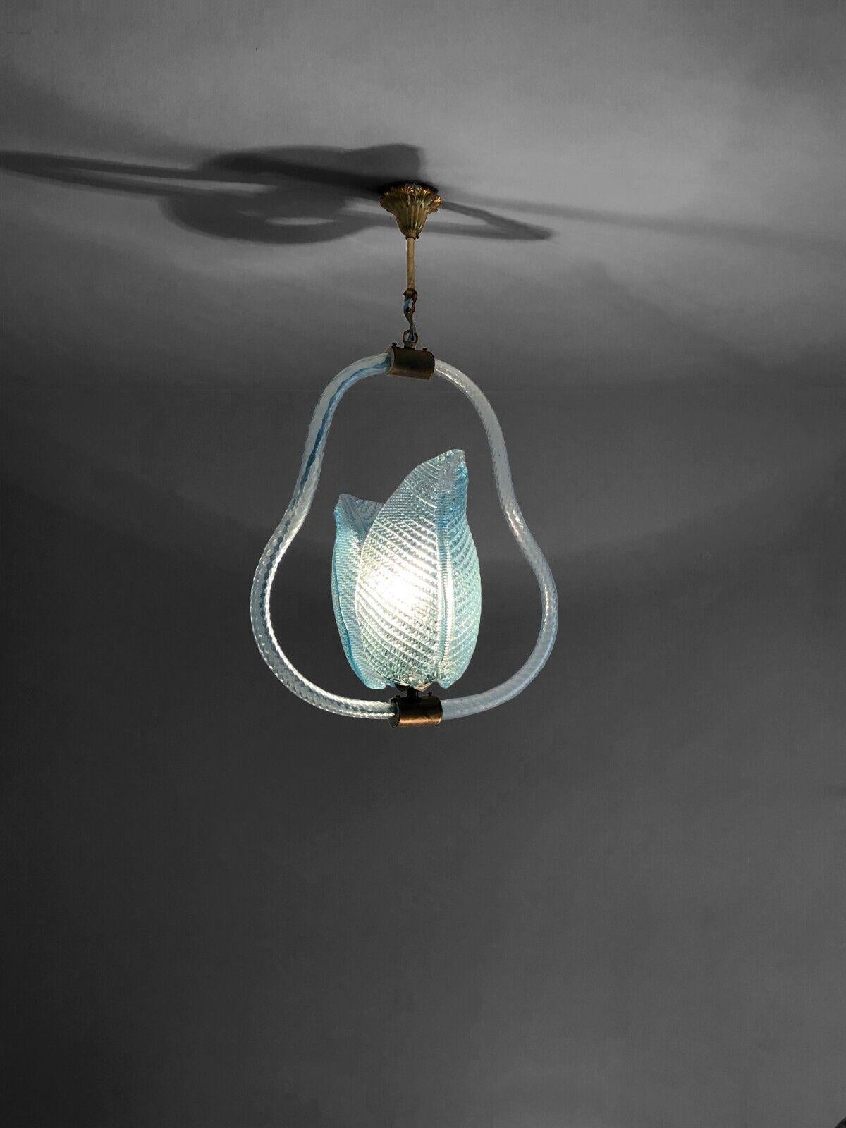 An exceptional, spectacular and elegant suspension chandelier, Art-Deco, Neo-Classical, cylindrical structures in thick patinated bronze, 2 arms in twisted glass and 2 leaves in blown cyan Murano glass with particularly refined details and reliefs,