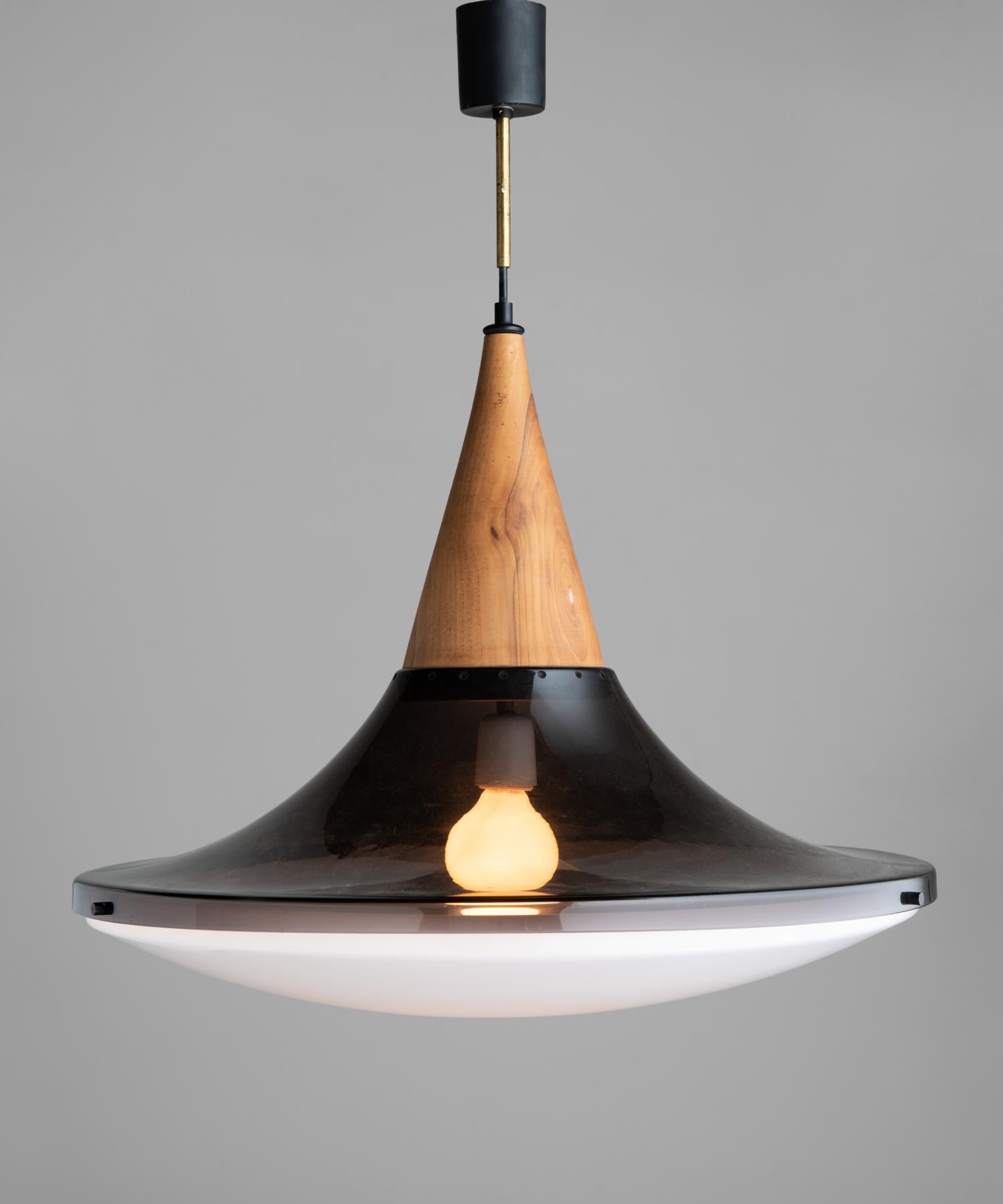 Suspension lamp by Goffredo Reggiani, Italy, circa 1960.

With wooden fitter and two-part plexiglass shade.

Measures: 24