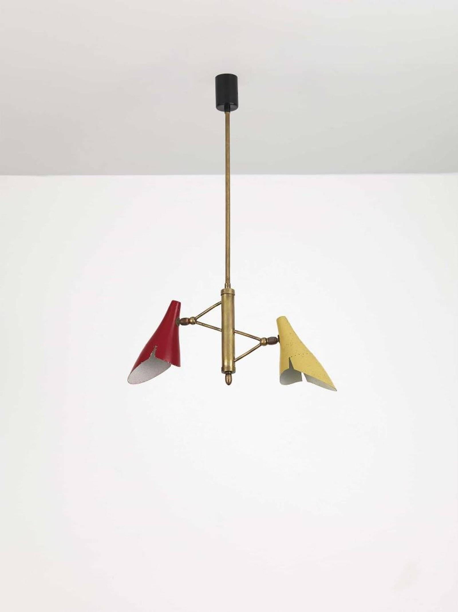 1950s Italian suspension lamp by Oscar Torlasco for Lumen, Milano with brass structure and color enameled distinctively formed aluminum cones. 

See images 12-14 for examples of the more commonly seen table lamp version of this design.