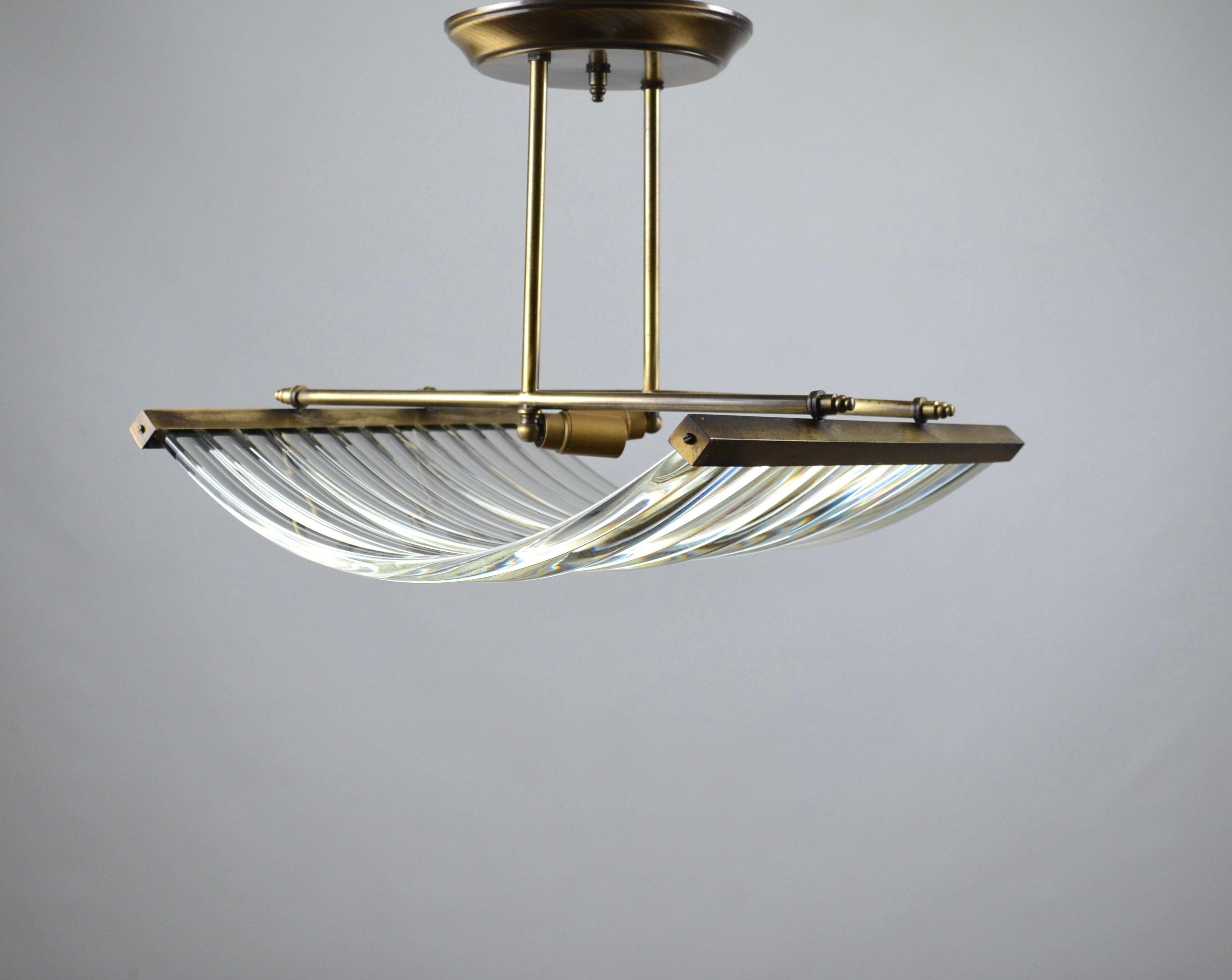 Rare suspension made by the Portuguese lamp designer, Antonio Da Piedade, in the 1970s.
It is composed of a brass structure and 13 manually curved translucent glass bars. Very elegant.