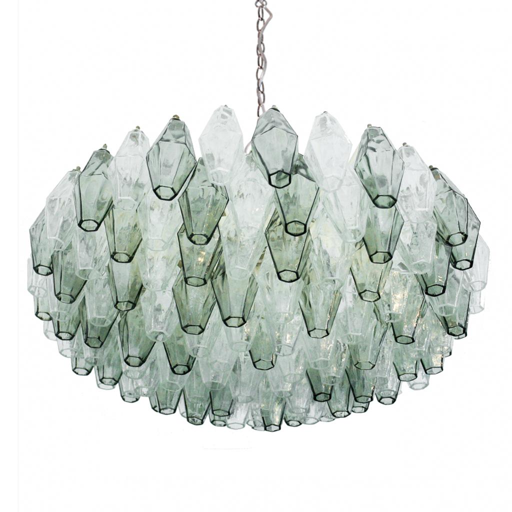 Suspension lamp model “Poliedri” designed by Carlo Scarpa, edited by Venini. Composed by pieces of solid crystal over a structure made in white lacquer metal.