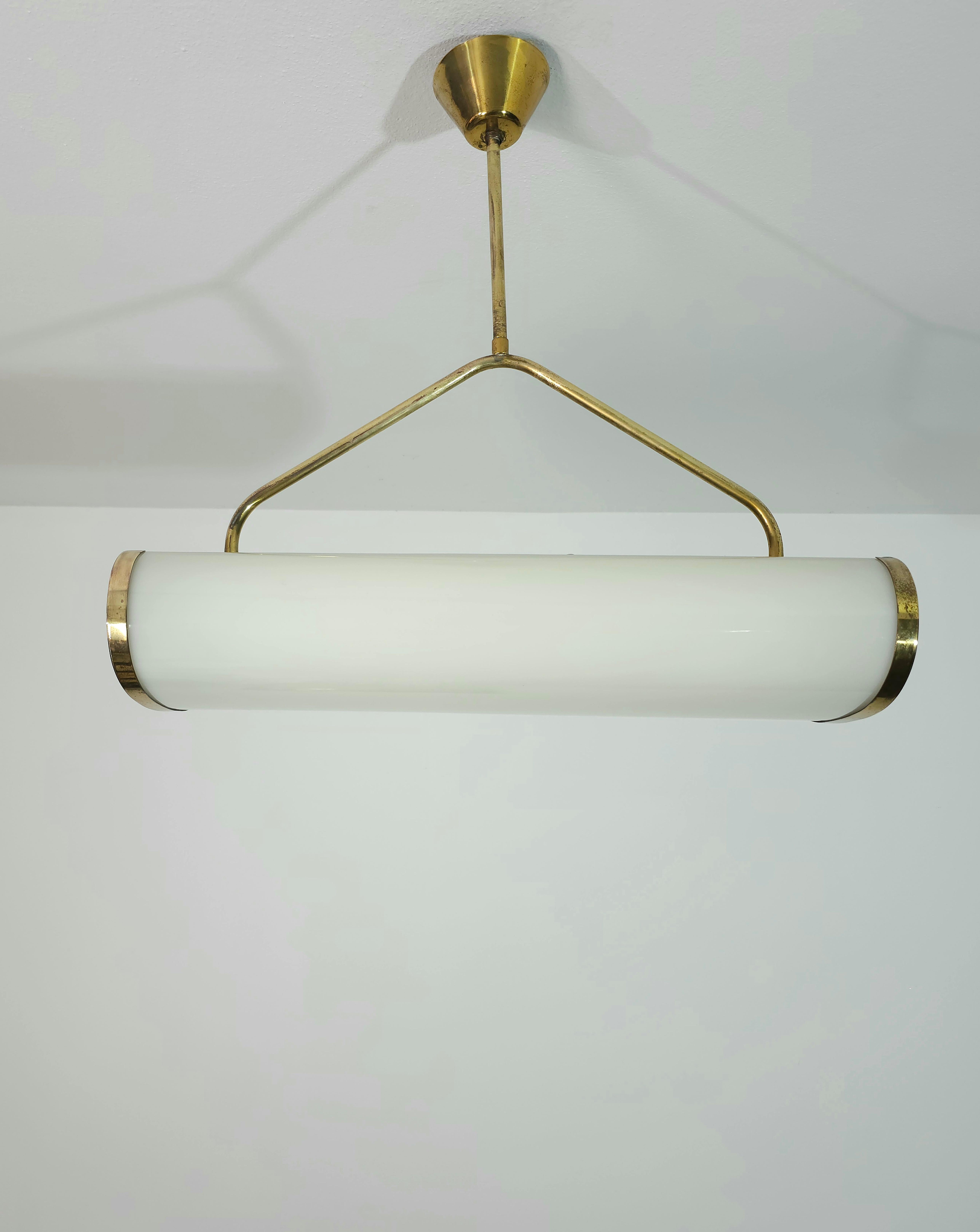 Rare 2-light pendant lamp made of brass which supports a curved lactated plexiglass diffuser.  Italy 1960s.


Note: We try to offer our customers an excellent service even in shipments all over the world, collaborating with one of the best shipping