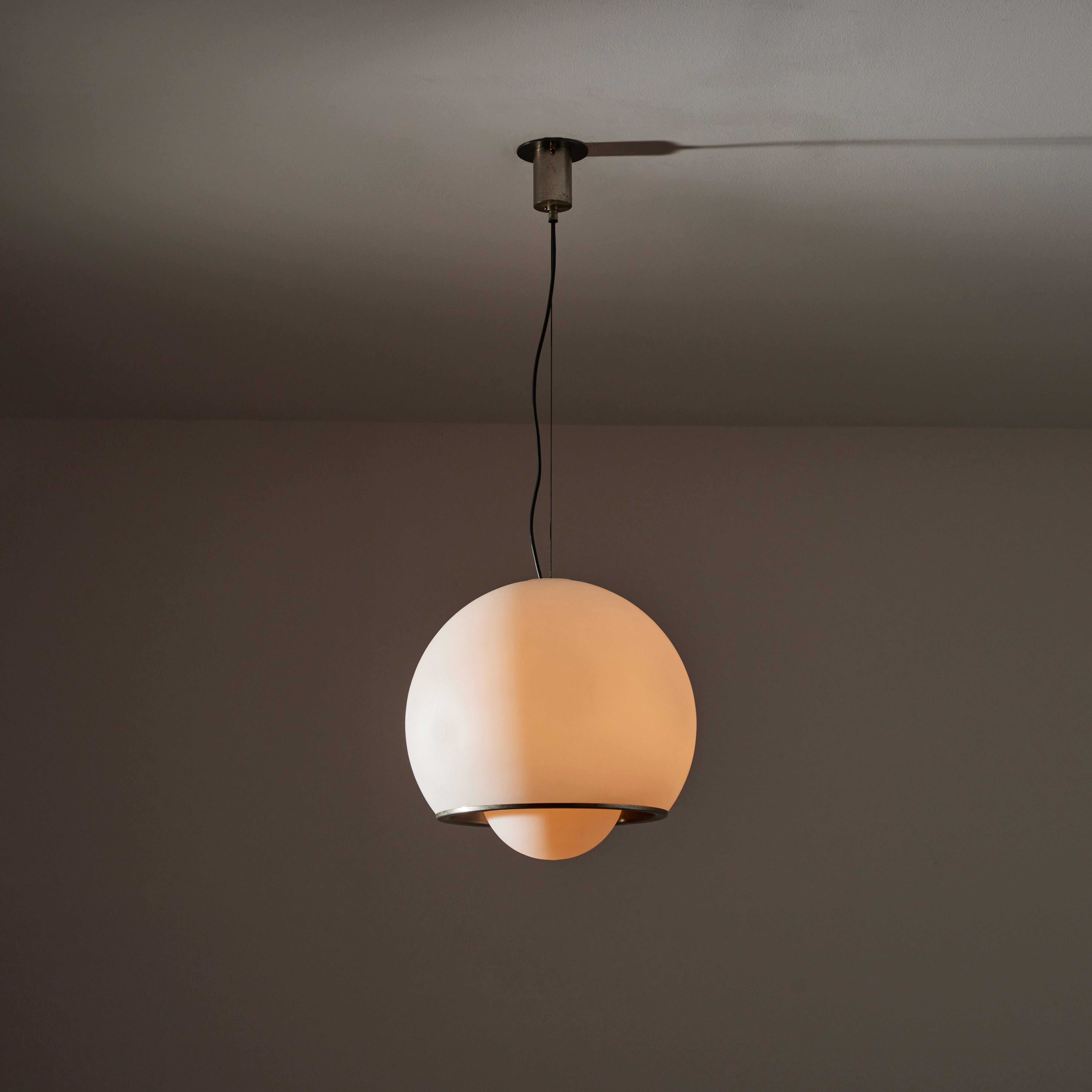 Suspension light by Fontana Arte. Designed and manufactured in Italy, circa 1960s. Satin glass diffuser, satin nickel hardware. Custom ceiling plate. Rewired for U.S. standards. We recommend one E27 60 watt maximum bulb. Recommend Lamping: 120v 1