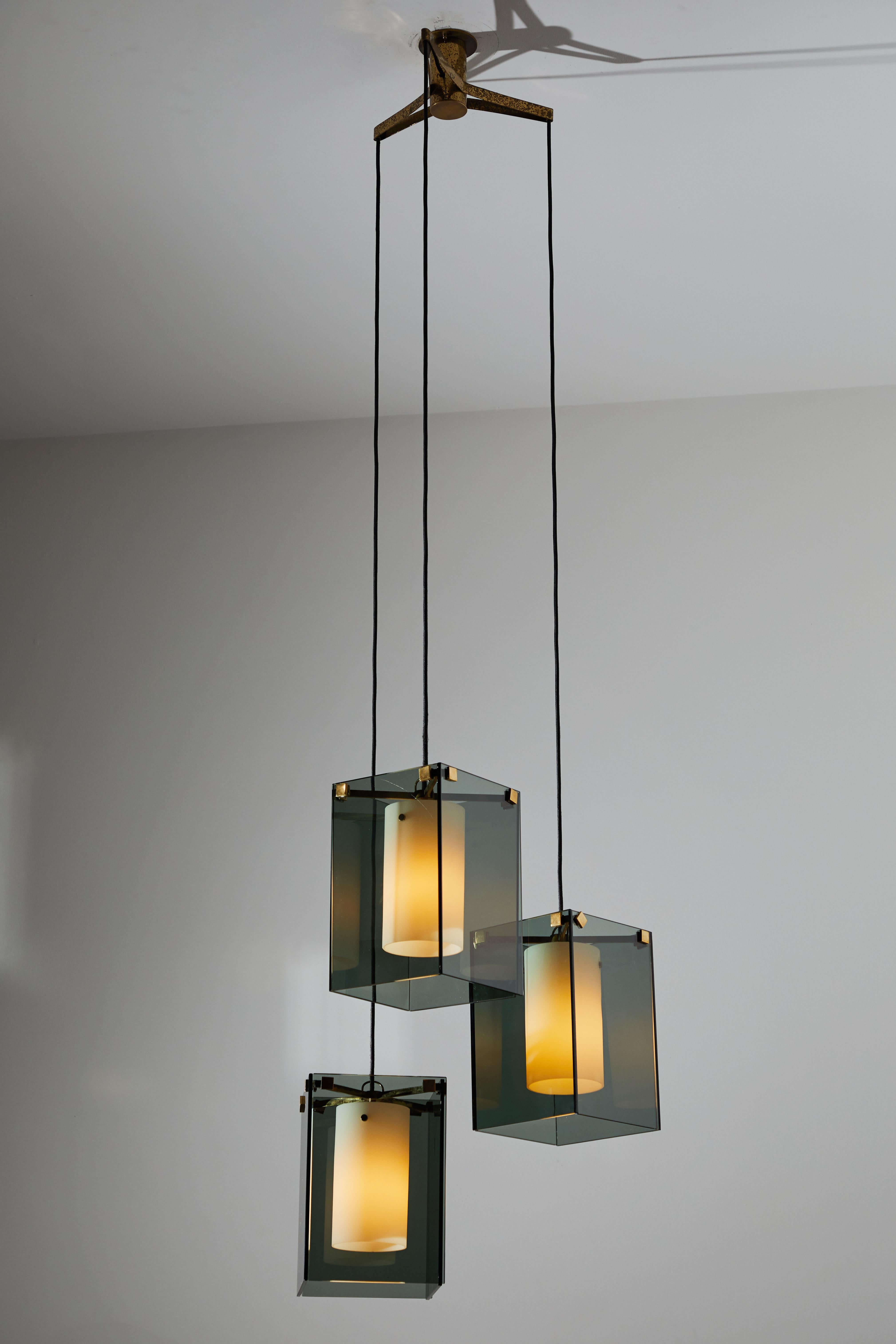 Suspension light by Max Ingrand for Fontana Arte. Designed and manufactured in Italy, circa 1960. Glass diffusers, brushed satin glass internal cylinders, brass armature and hardware. Custom brass ceiling plate. Rewire for U.S. junction boxes. Takes