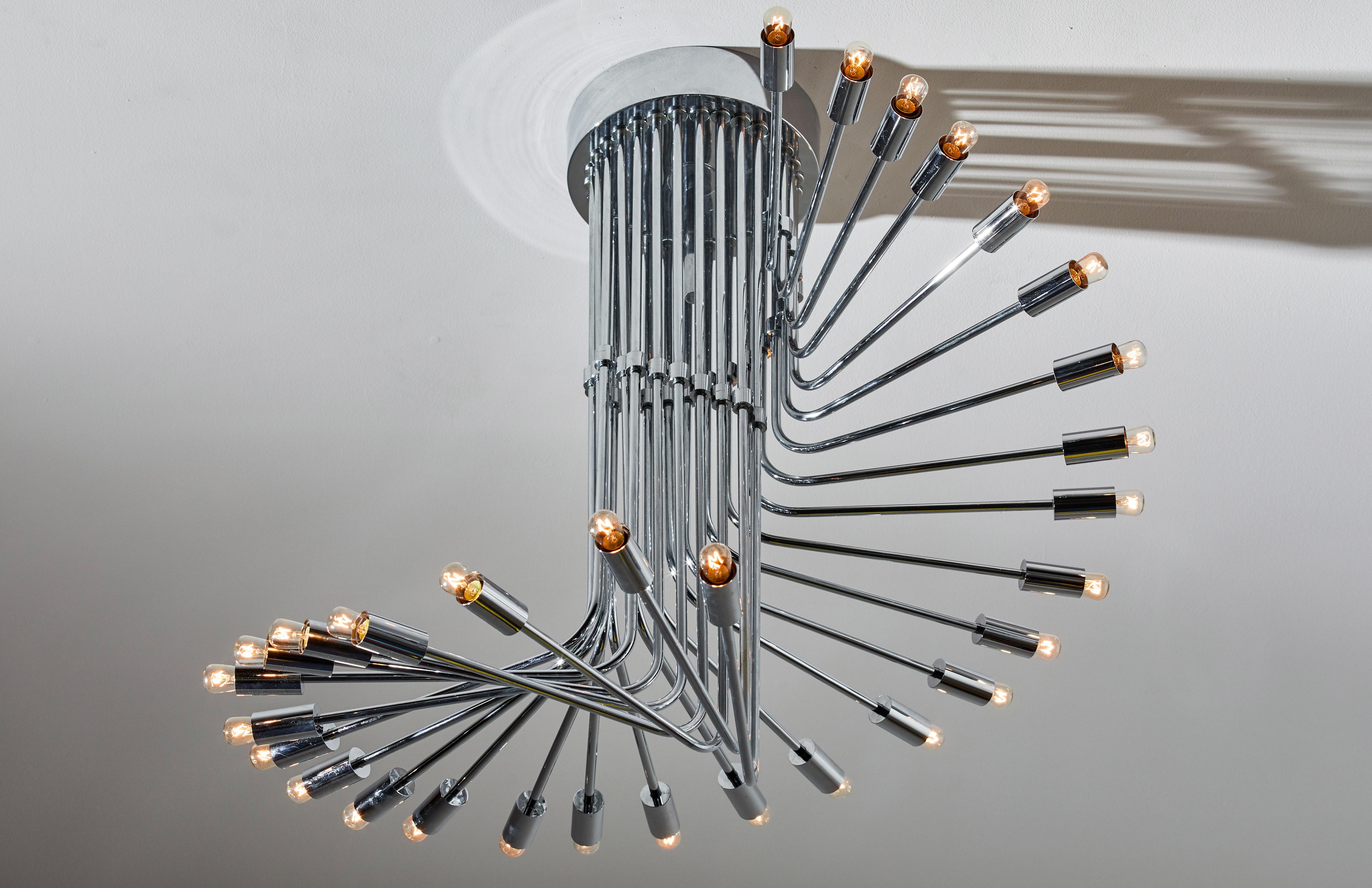 Suspension light by Reggiani. Manufactured in Italy, circa 1970s. Chrome-plated brass. Rewired for U.S. junction boxes. Takes 30 E27 25W maximum bulbs. Bulbs provided as a one time courtesy.