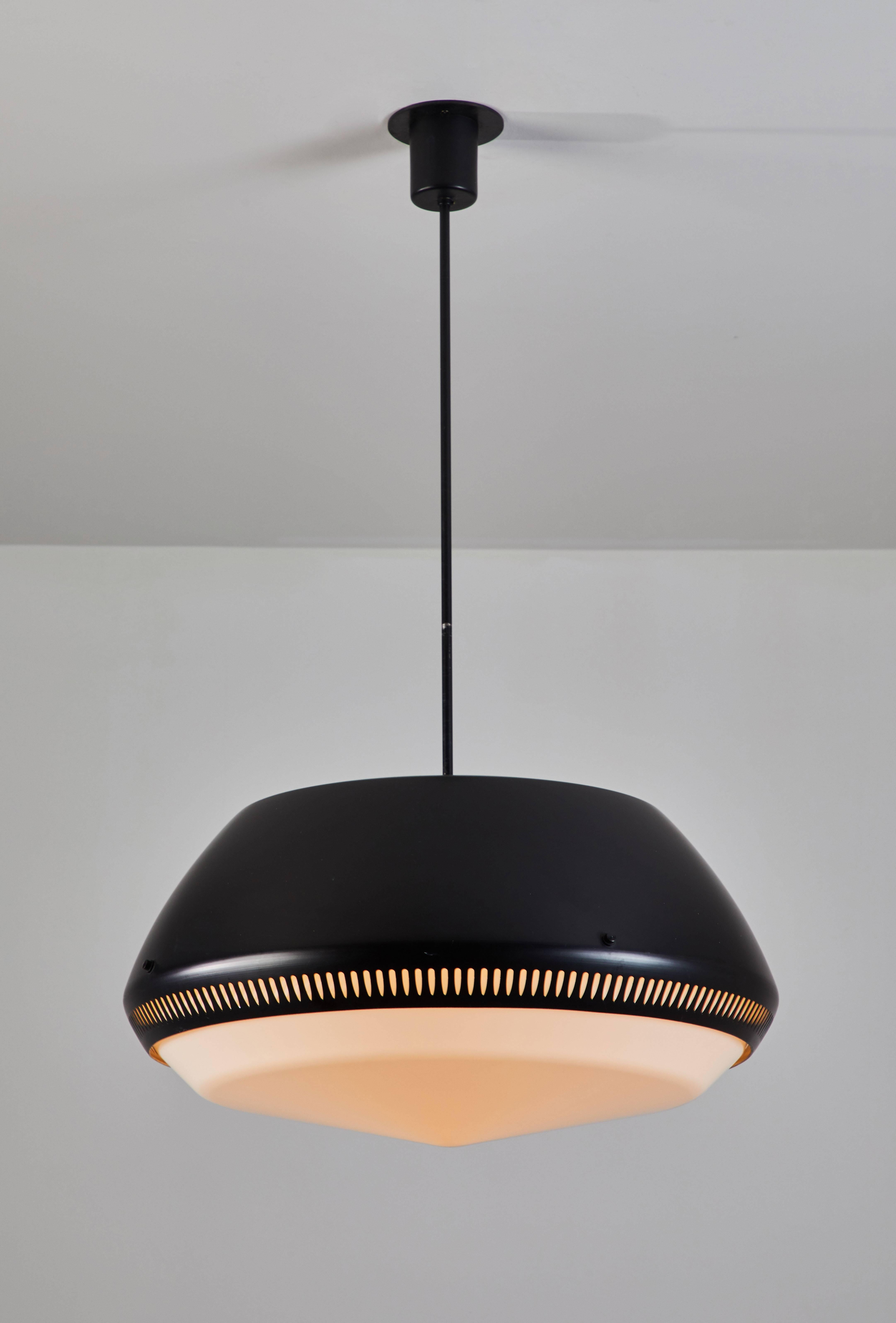 Pendant by Sergio Asti for Arteluce. Designed and manufactured  in Italy, circa 1950's. Lacquered aluminum with white acrylic diffuser. Rewired for US junction boxes. Takes one E27 100w maximum bulb. Overall drop can be adjusted.