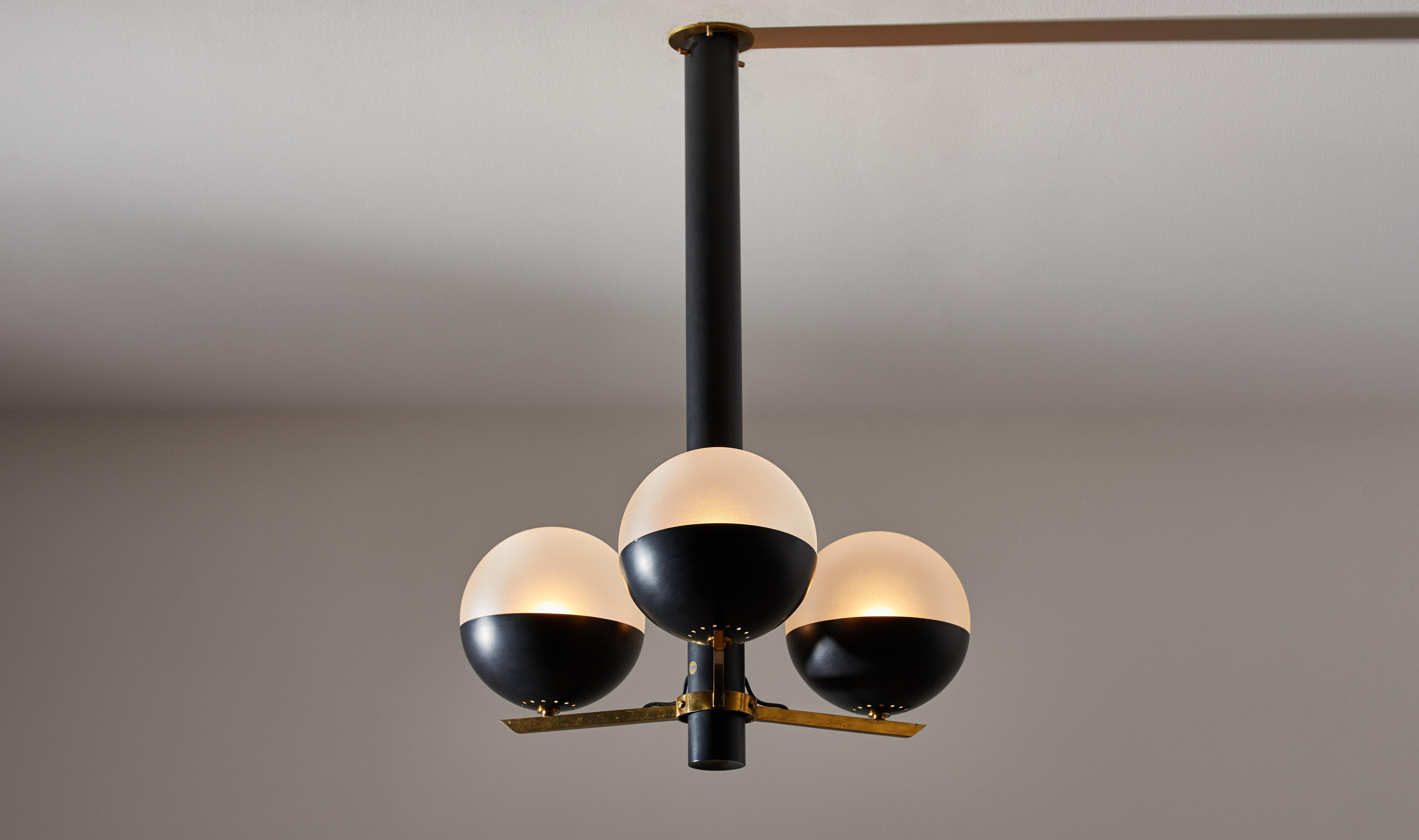 Suspension light by Stilnovo. Manufactured in Italy, circa 1960s. Enameled metal and opaline glass with brass hardware. Rewired for U.S. junction boxes. Custom brass ceiling plate. Takes three E27 60w maximum bulbs. Bulbs provided as a onetime