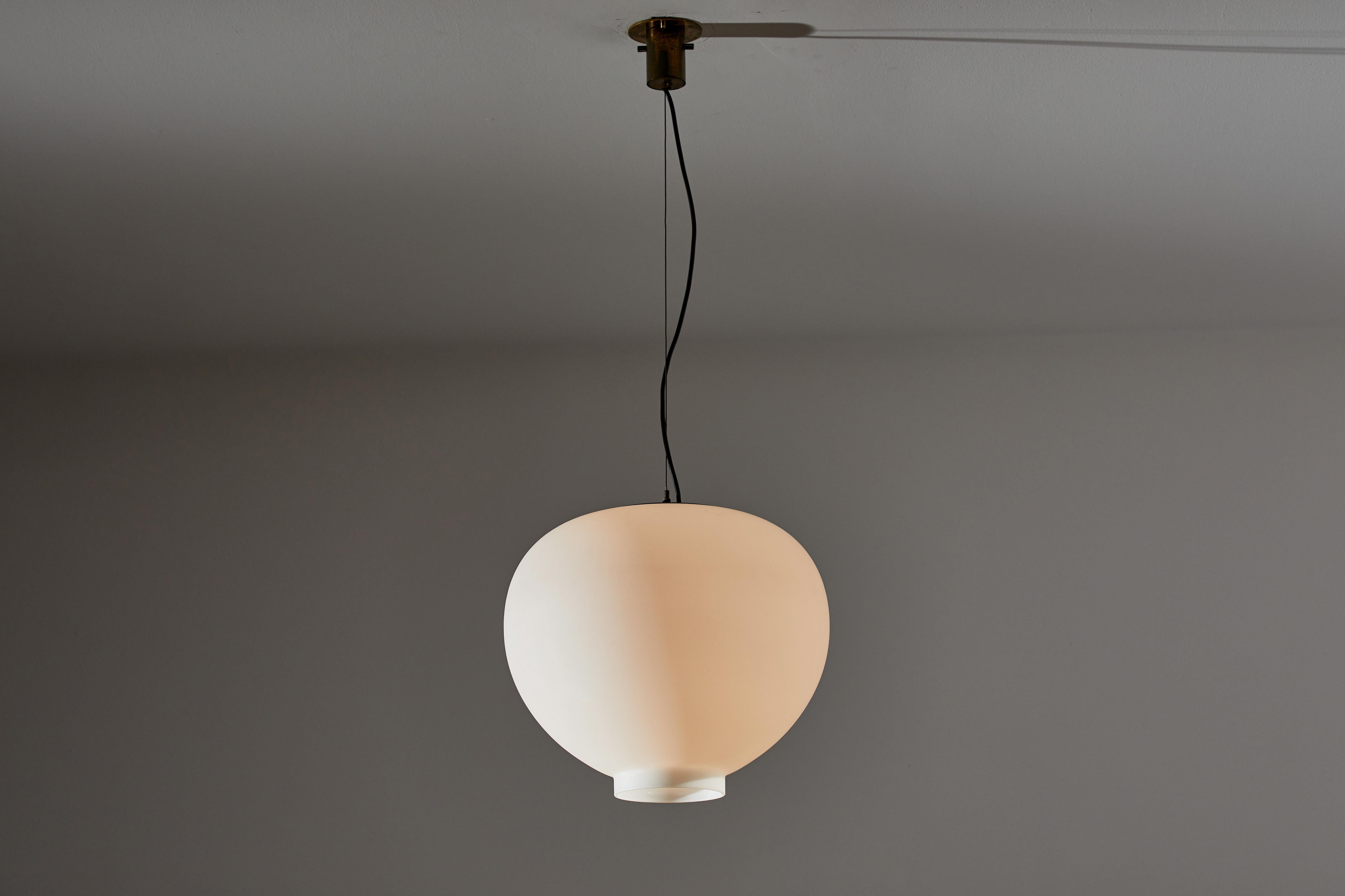 Suspension light by Stilnovo. Manufactured in Italy, circa 1950s. Brushed satin glass diffuser, brass hardware. Rewired for U.S. standards. Original canopy, custom brass ceiling plate. Takes one E26 100w maximum bulb. Bulb provided as a one time