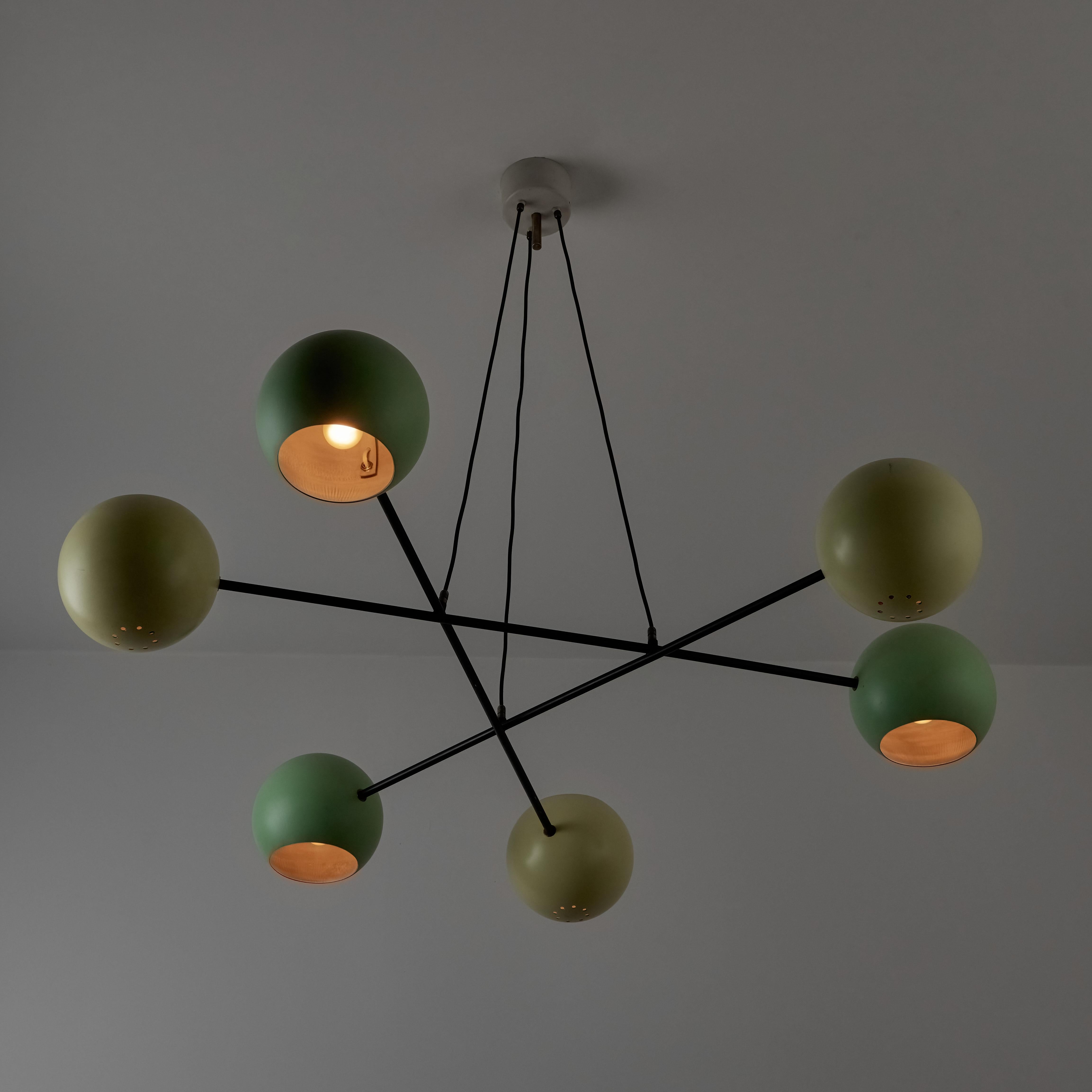 Suspension light by Stilnovo. Designed and manufactured in Italy, circa the 1950s. A mobile suspension chandelier with a playful color way. The two-toned shades are in a sequence order, consisting of dark teal and a muted light green. The shades are