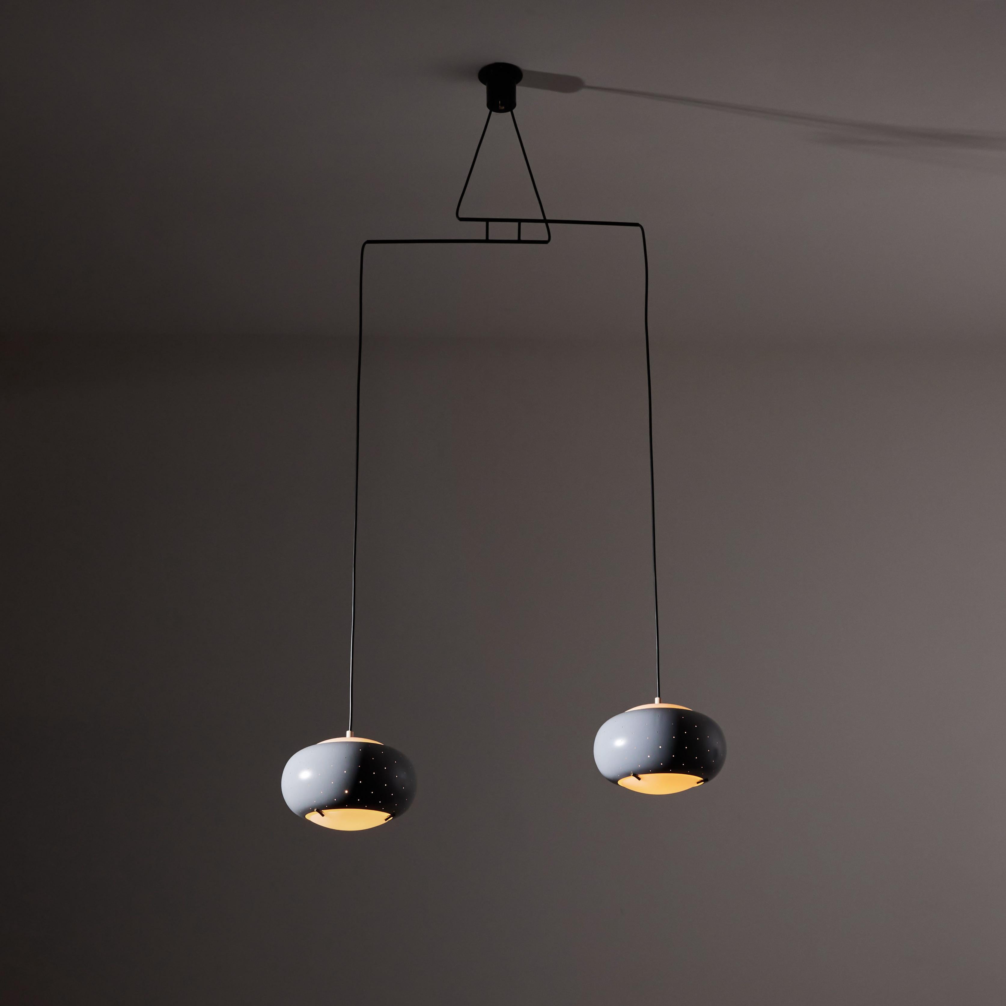 Suspension light by Stilux. Manufactured in Italy, circa 1950's. Enameled metal, glass brass, custom brass backplates. Rewired for U.S. standards. We recommend two E27 100w maximum bulbs. Bulbs provided as a one time courtesy.
