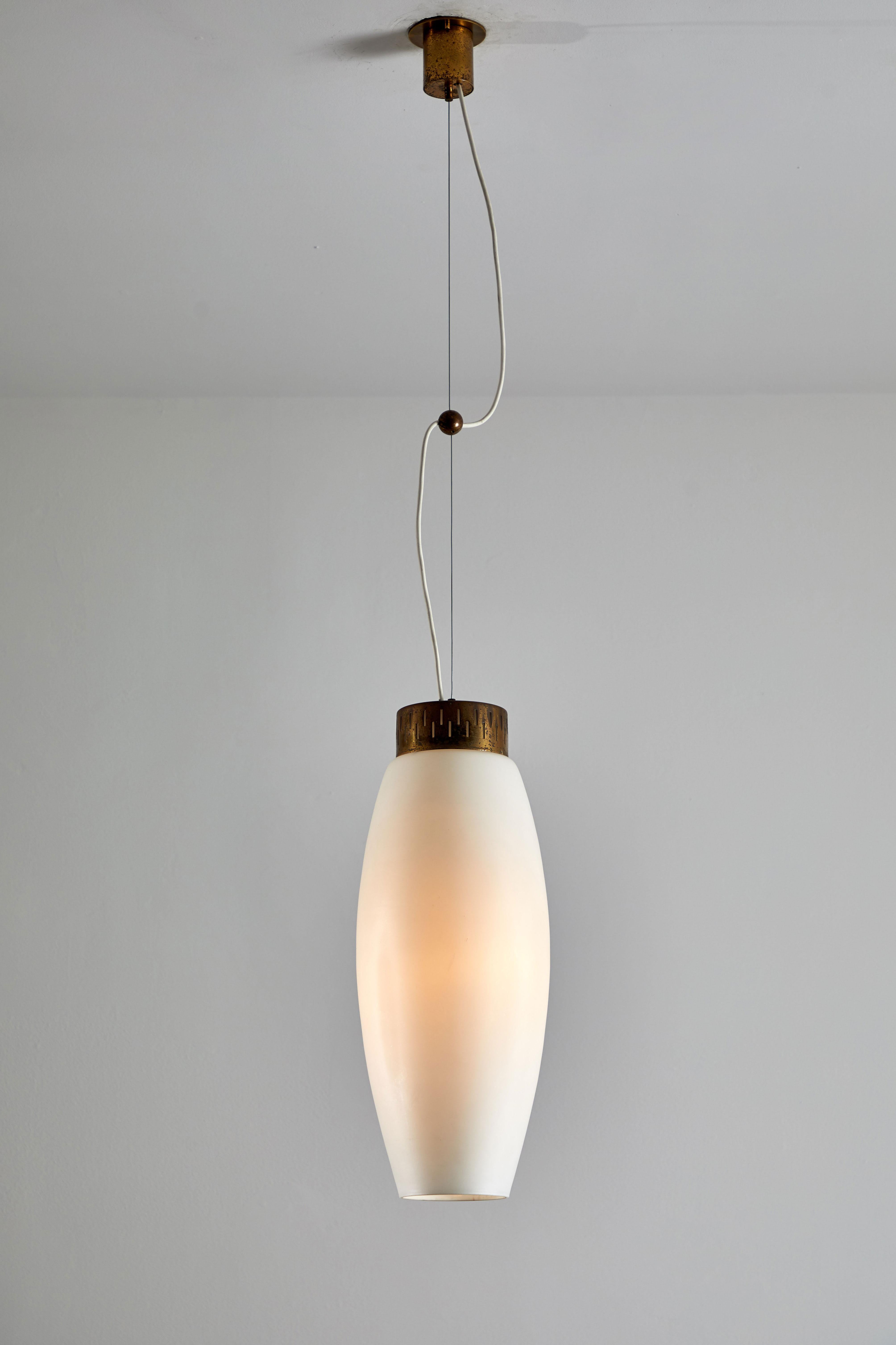 Suspension pendant by Stilnovo. Manufactured in Italy circa 1960s. Brushed satin glass diffuser, brass hardware, original brass canopy with custom brass ceiling plate. Rewired for US junction boxes. Takes one E27 75 W maximum bulb. Overall drop can