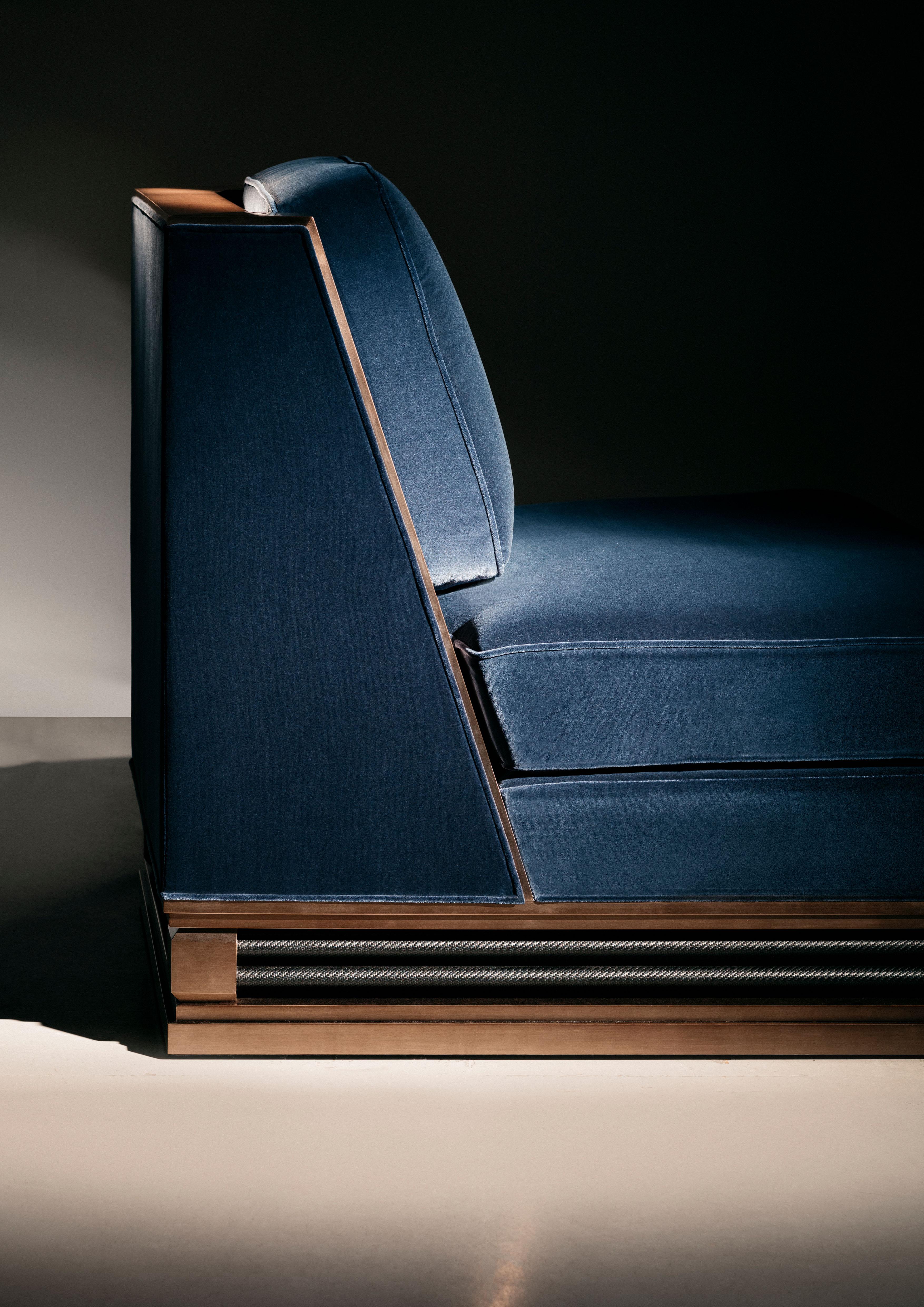 This elegant chair combines the sensuousness of upholstery with the precision of an exposed metal frame. Its angled physique mounted on the tensile tactility of a compact metal base.
