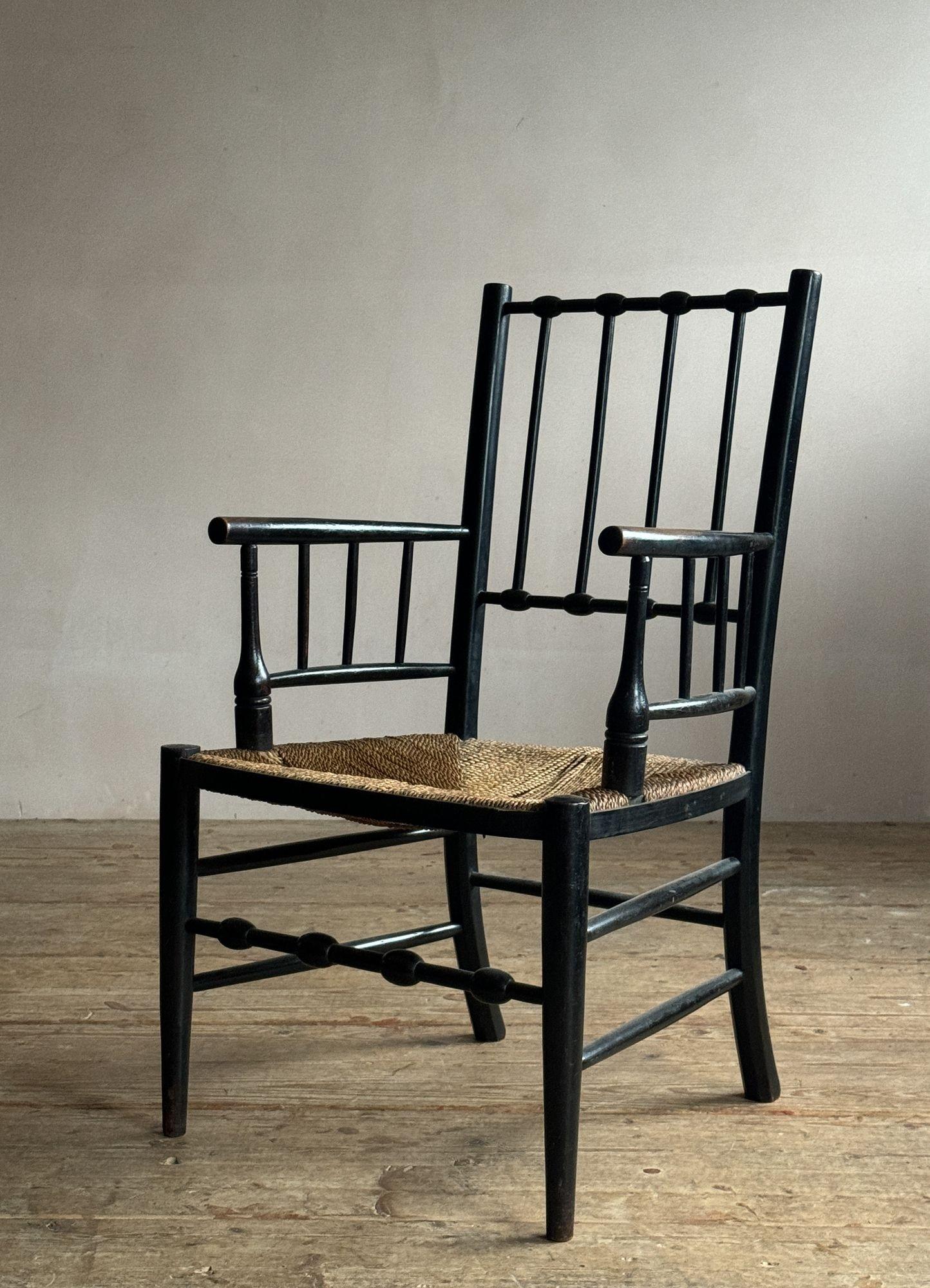 An early 20thC beech Sussex armchair, possibly by Morris & Co.
Dimensions:
H 88cm
Seat H 41cm
W 52cm
D 52cm