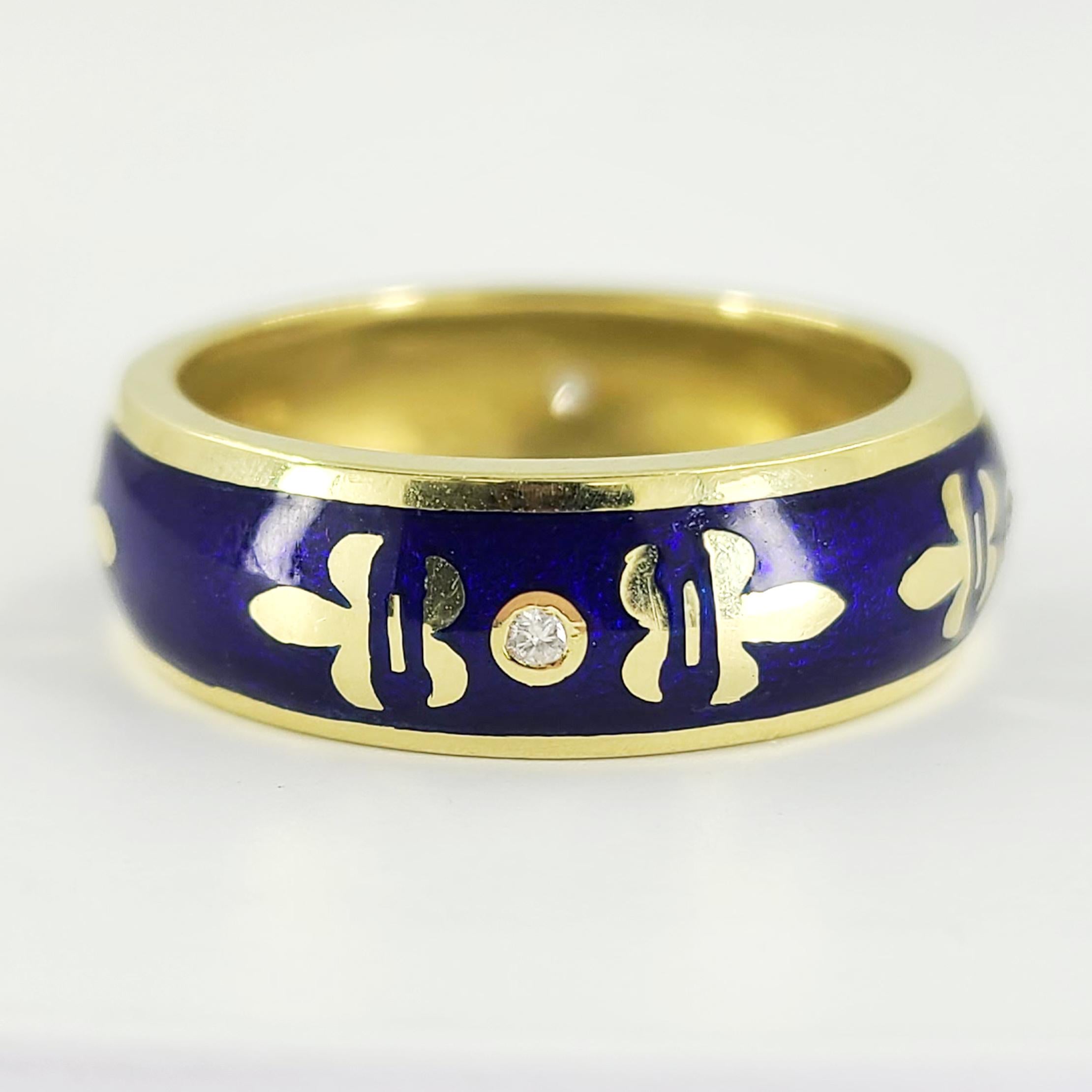 Susy Mor 18 Karat Yellow Gold Blue Enamel Band Ring With Fleur De Lys Design Featuring 4 Round Diamonds Totaling 0.06 Carats. 7mm Width. Finished Weight Is 8.2 Grams. Finger Size 9.5.