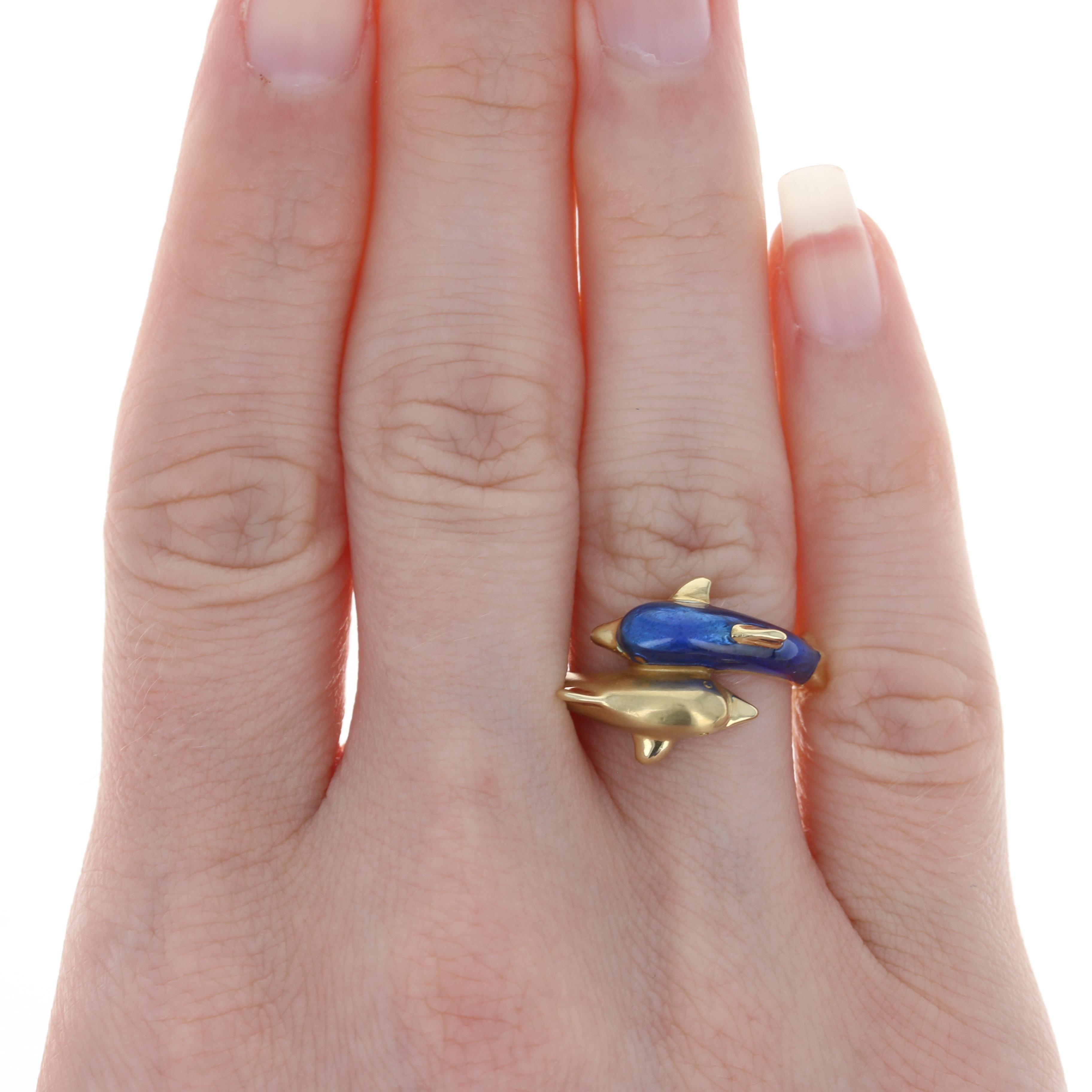 Whether you're by the sea or dreaming to be, this enchanting creation by Susy Mor is the perfect addition to your jewelry collection! Crafted in the United States, this luxurious 18k yellow gold bypass ring showcases one dolphin adorned with