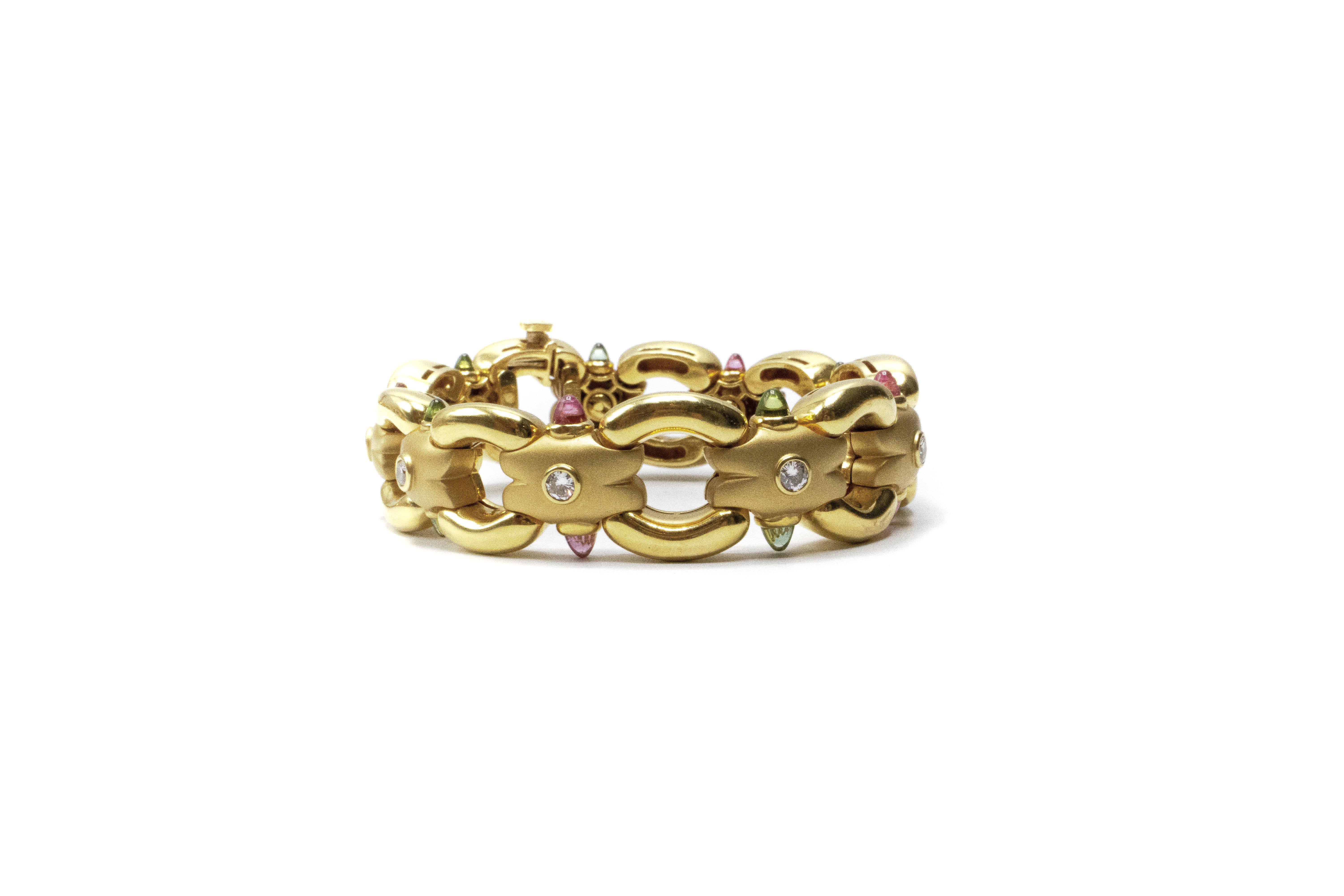 Susy Mor Tourmaline Diamond 18kt Gold Bracelet. Bracelet is adorned with custom cut pink and green tourmaline and round cut diamonds. Total weight is 84.16 grams 