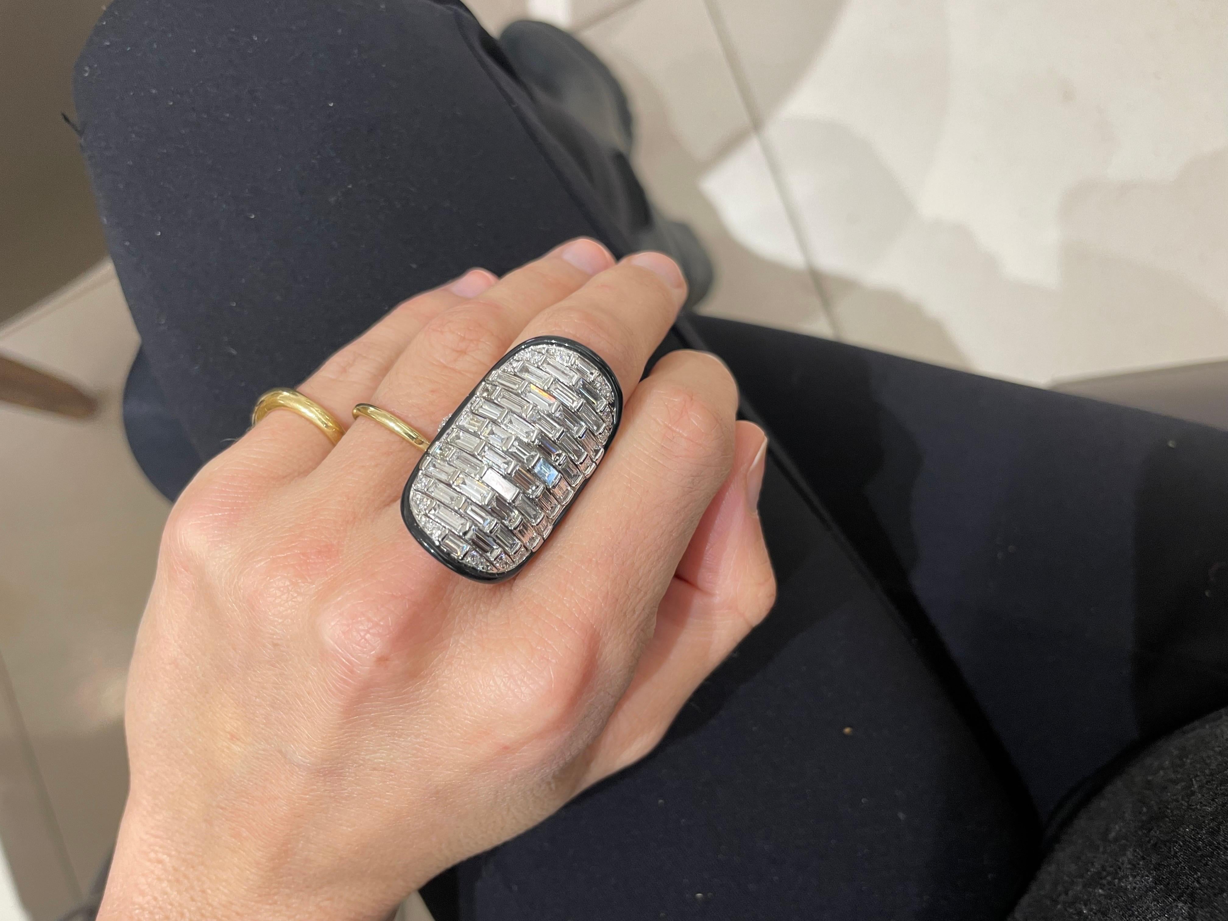 Art Deco inspired 18 karat white gold and diamond ring. The lengthy 1-1/4