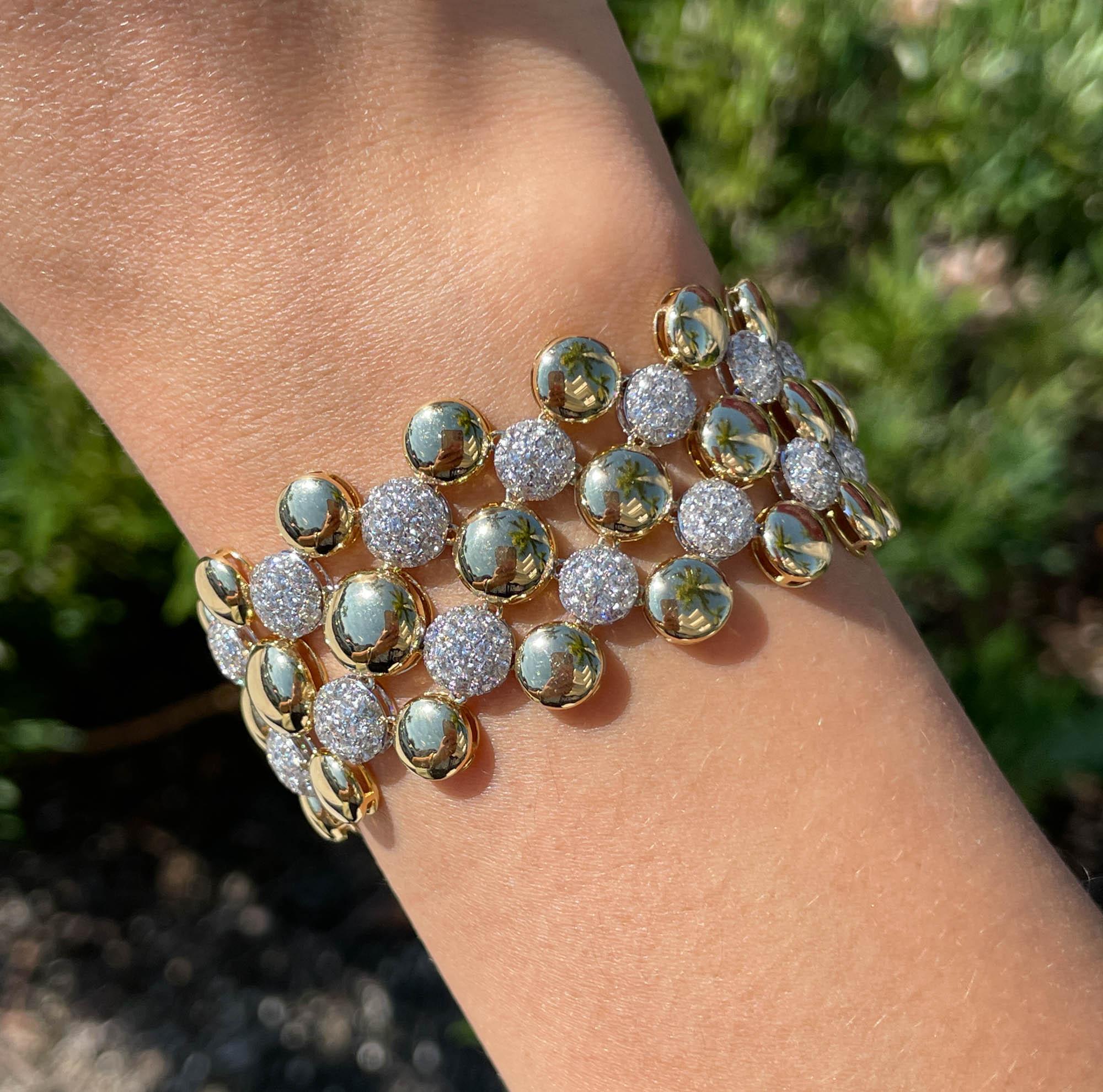 SUTRA 18k Two Tone Gold Diamond Bubble Bracelet
Total weight of diamonds is 8.43tcw.
The bracelet is 6.5 inches long and 1 inch wide.
The total weight is 40.2 grams.

Please view our photos and videos for more details.

Good condition, minor