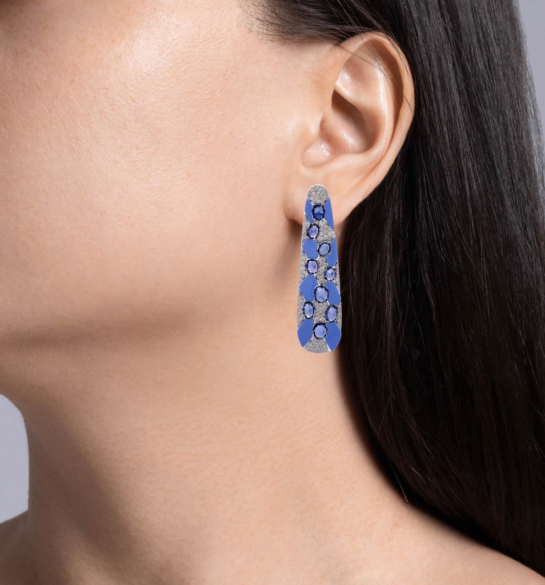 Sutra 18k White Gold Blue Sapphire and Diamond Blue Ceramic Earrings
Total weight of blue sapphires is 7.82ct.
Total weight of round diamonds is 2.55ct.
Each earring is 2.25 inches long.
The total weight is 21.9 grams.

Please view our photos and