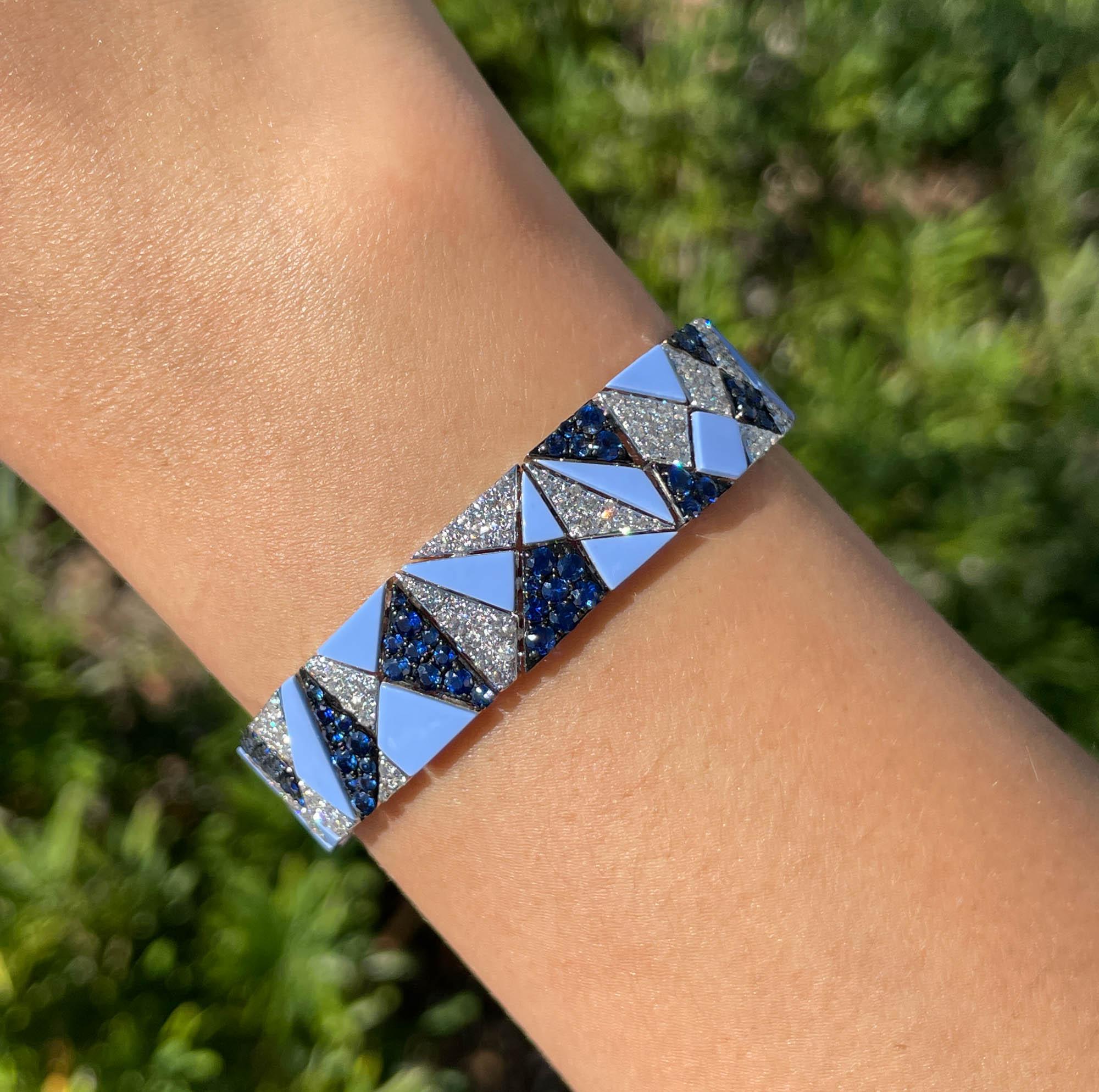 SUTRA 18k White Gold Sapphire and Diamond Bracelet
Total weight of blue sapphires is 5.86tcw.
Total weight of diamonds is 4.16tcw.
The bracelet is 7 inches long and 0.5 inches wide.
The total weight is 32.6 grams.

Please view our photos and videos